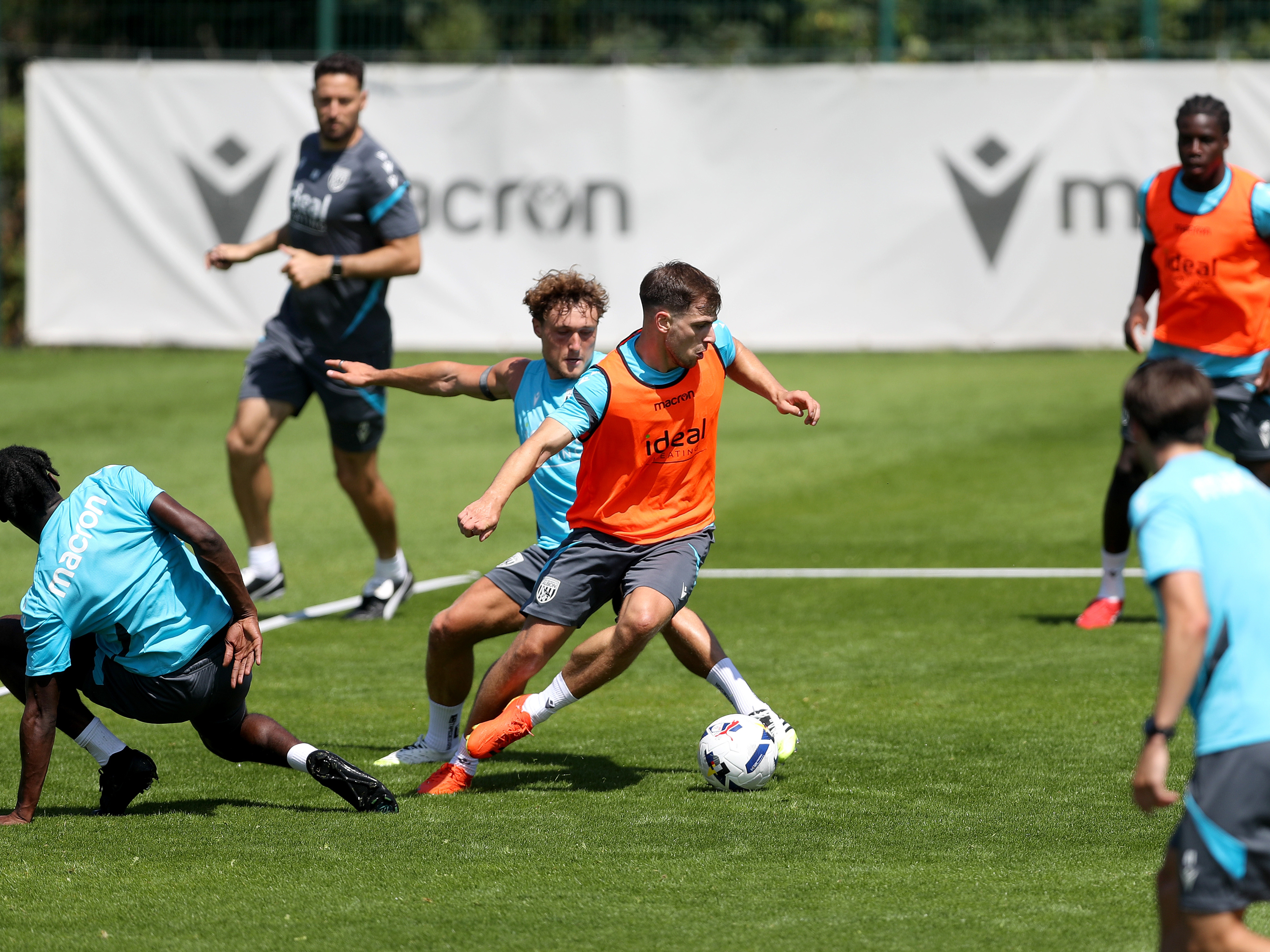 Jayson Molumby on the ball during training with Callum Styles chasing him