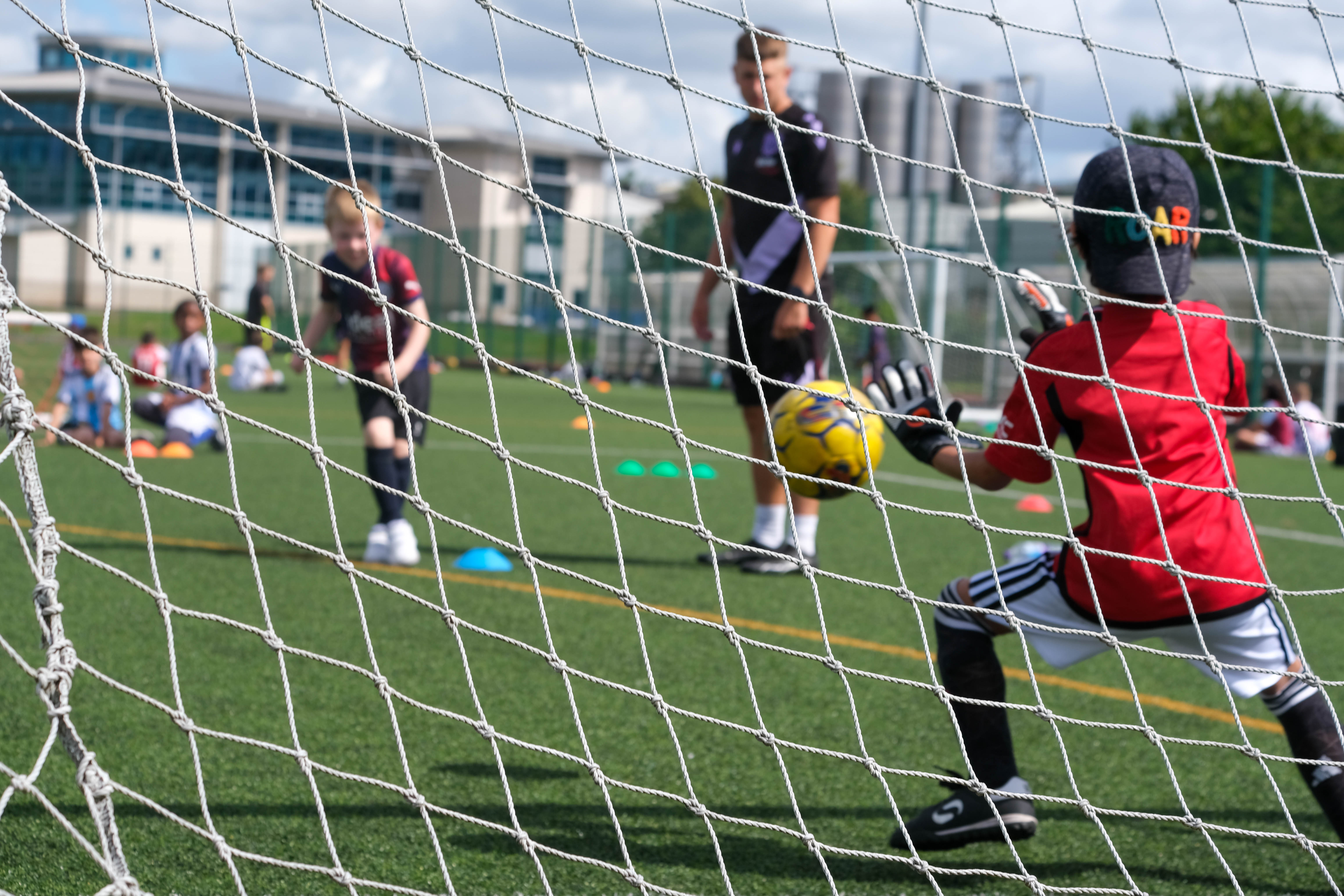 Player taking a penalty with goalkeeper in position to make a save.