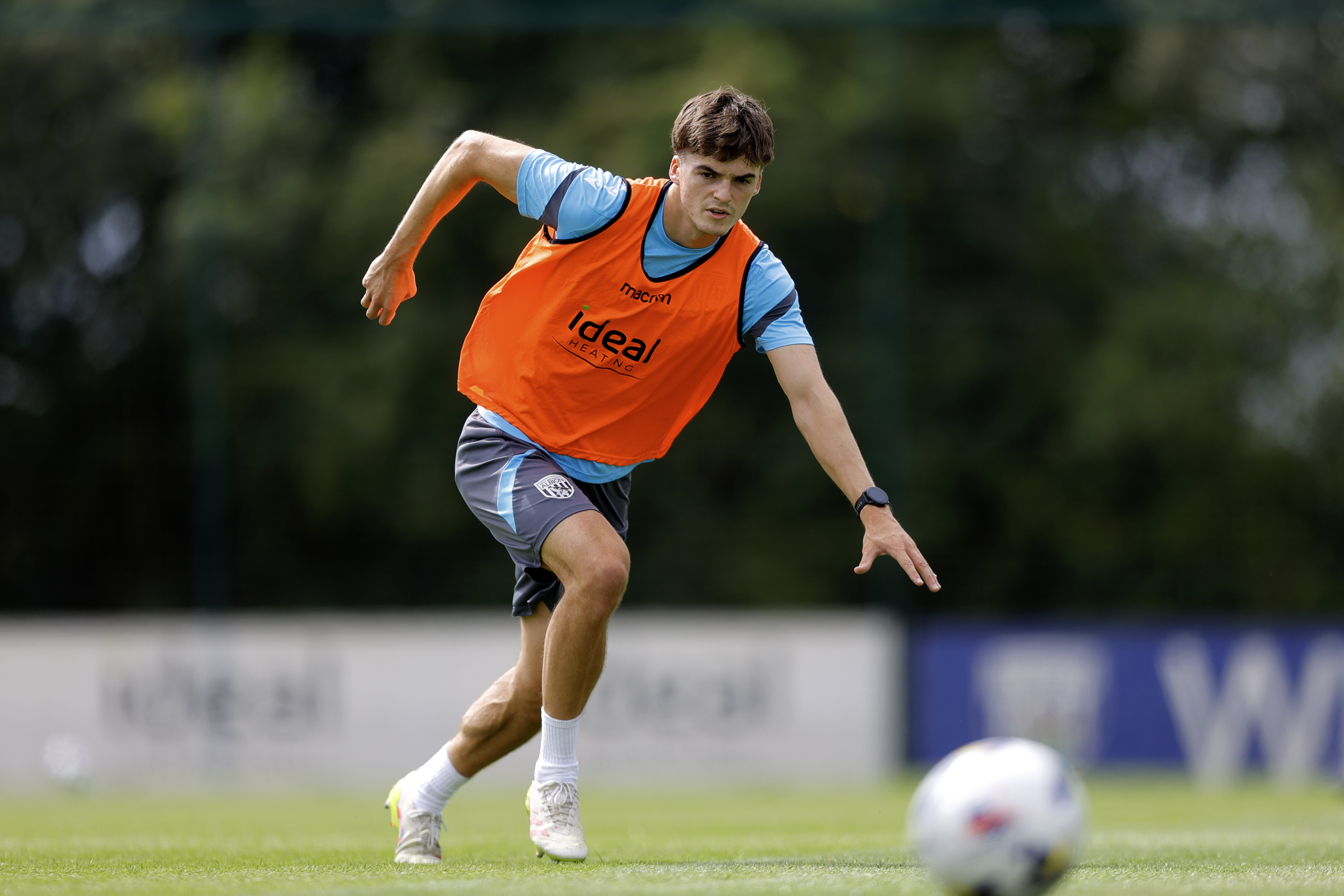Alex Williams chasing the ball during training 