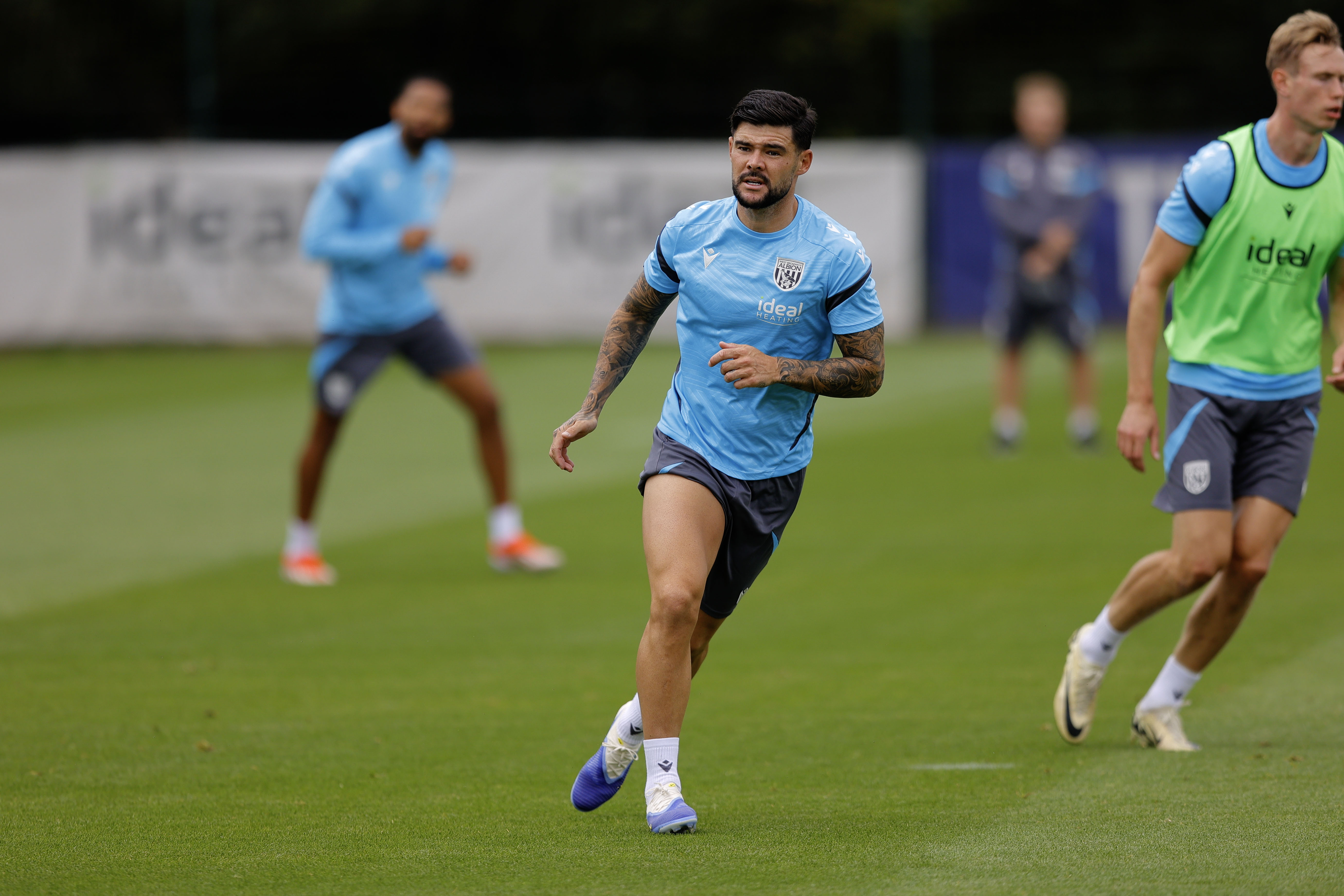 Alex Mowatt looking out for the ball during a training session
