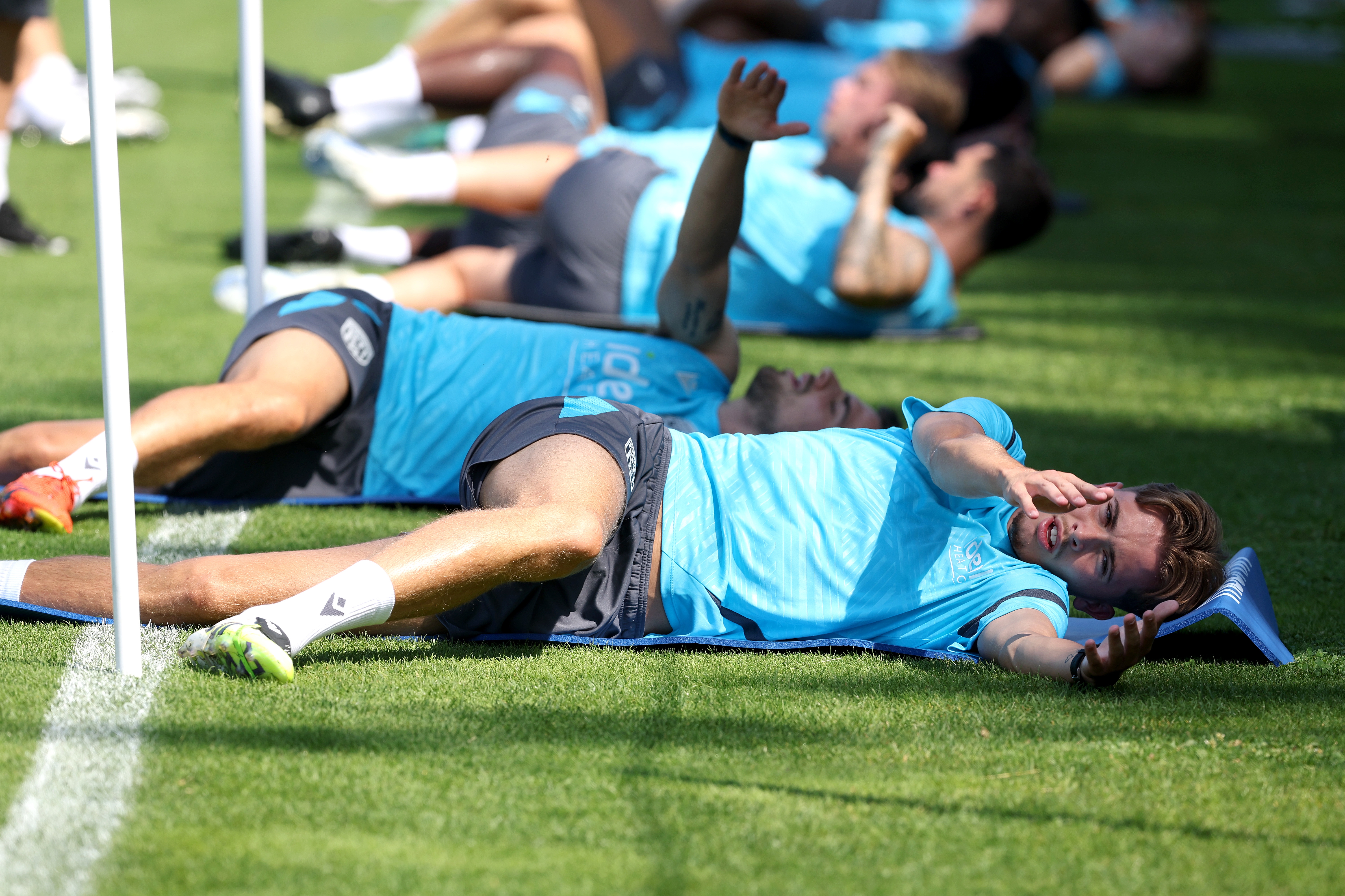 Albion players stretching before a training session