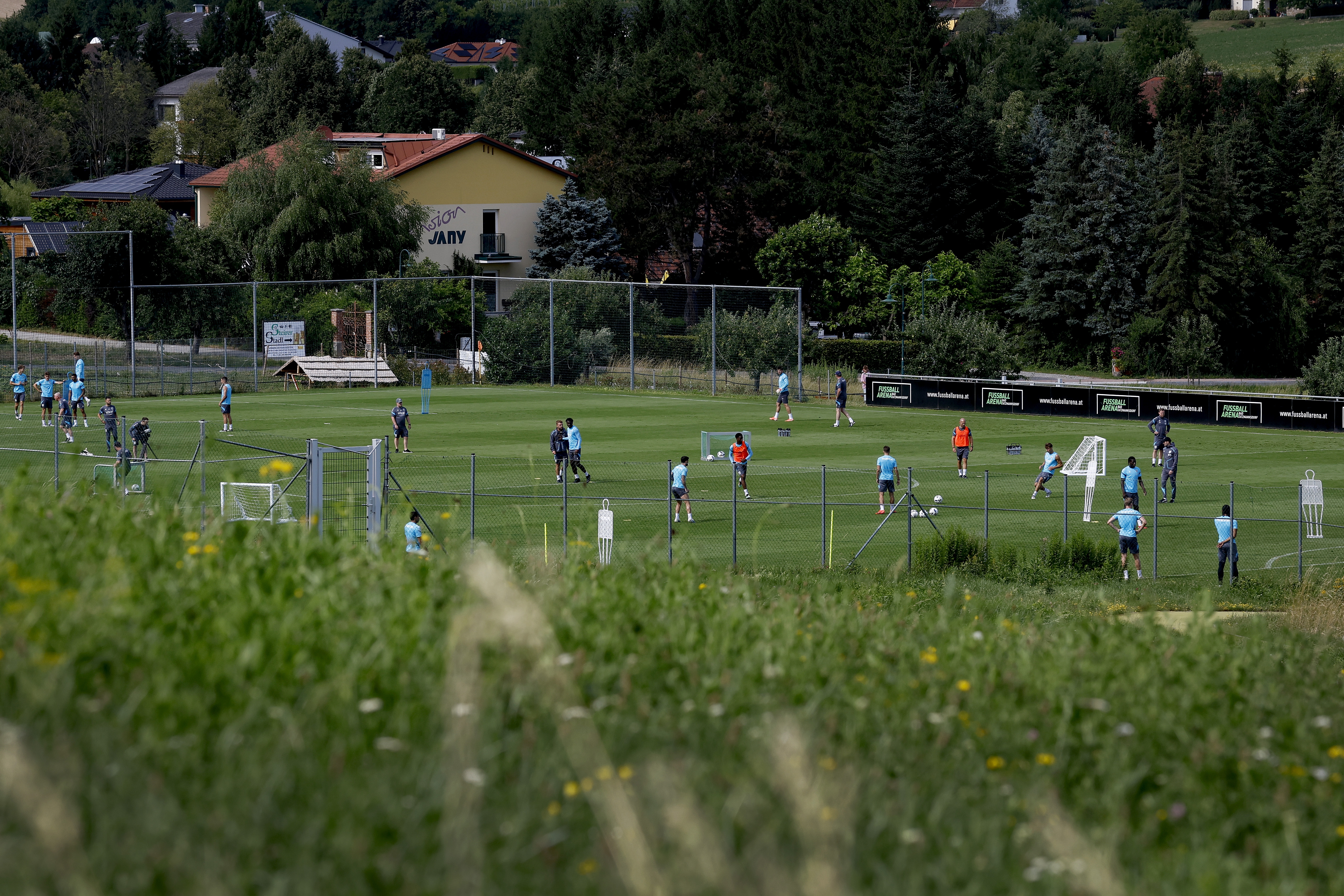 A general view of training from a vantage point with the pitch at the bottom of the hills