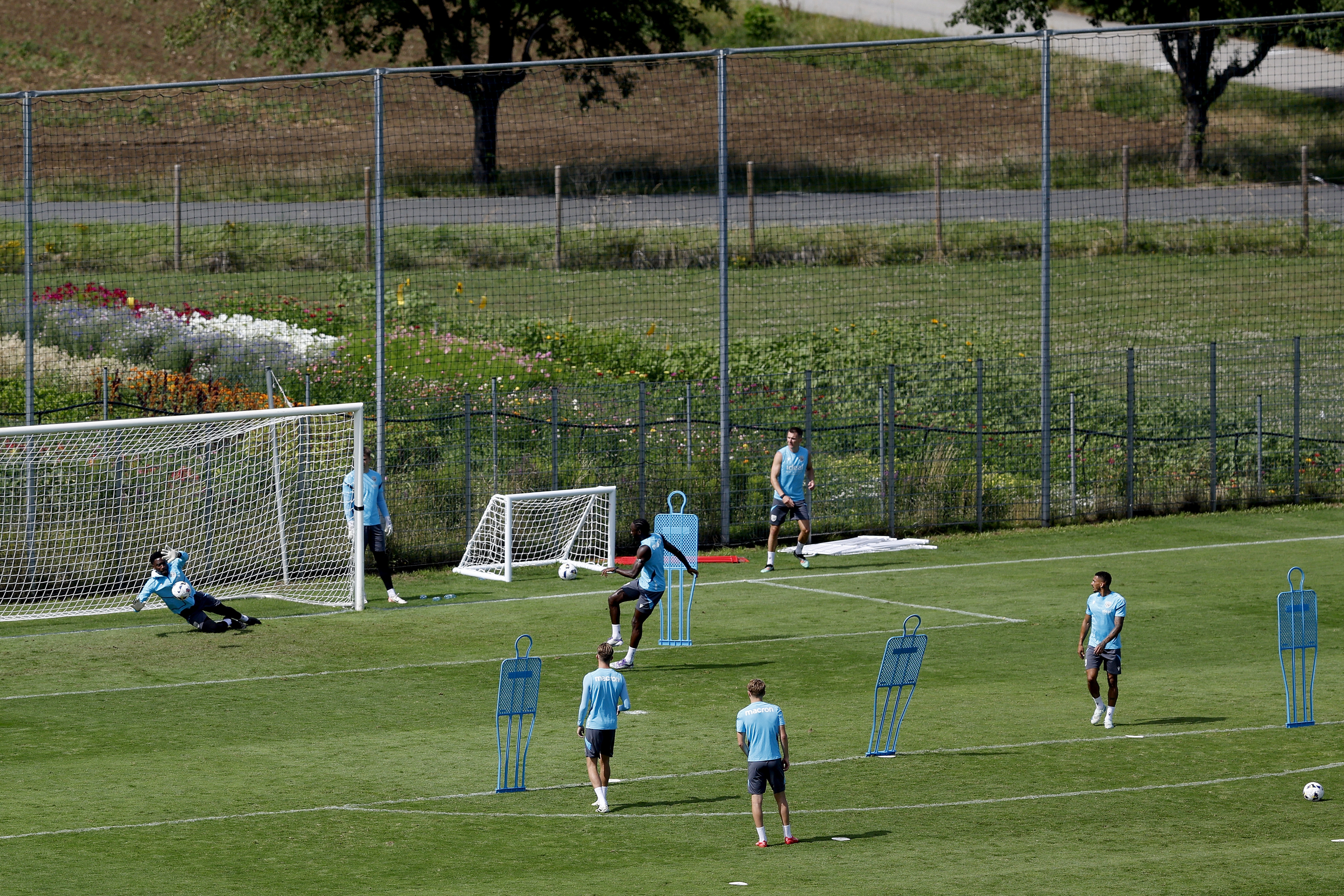 A general view of training from a vantage point with the pitch at the bottom of the hills