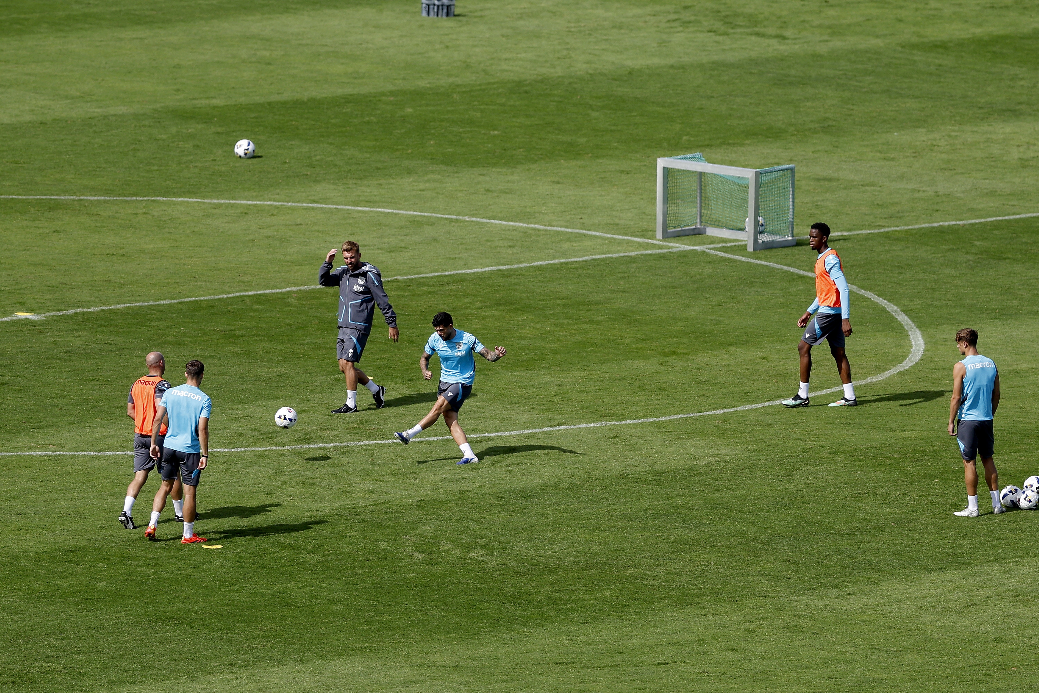 A general view of training from a vantage point with the pitch at the bottom of the hills
