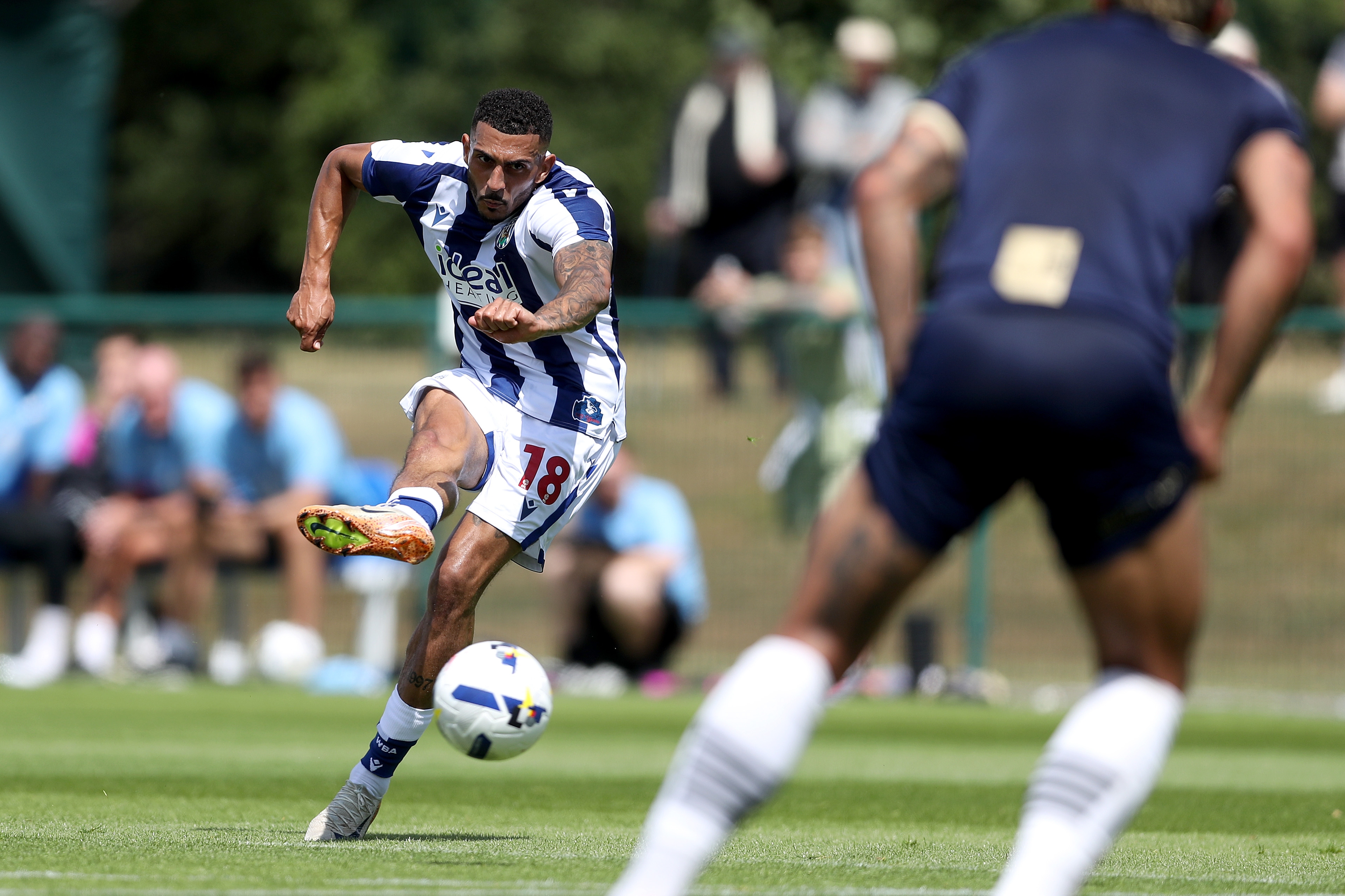 Karlan Grant striking the ball against Port Vale 