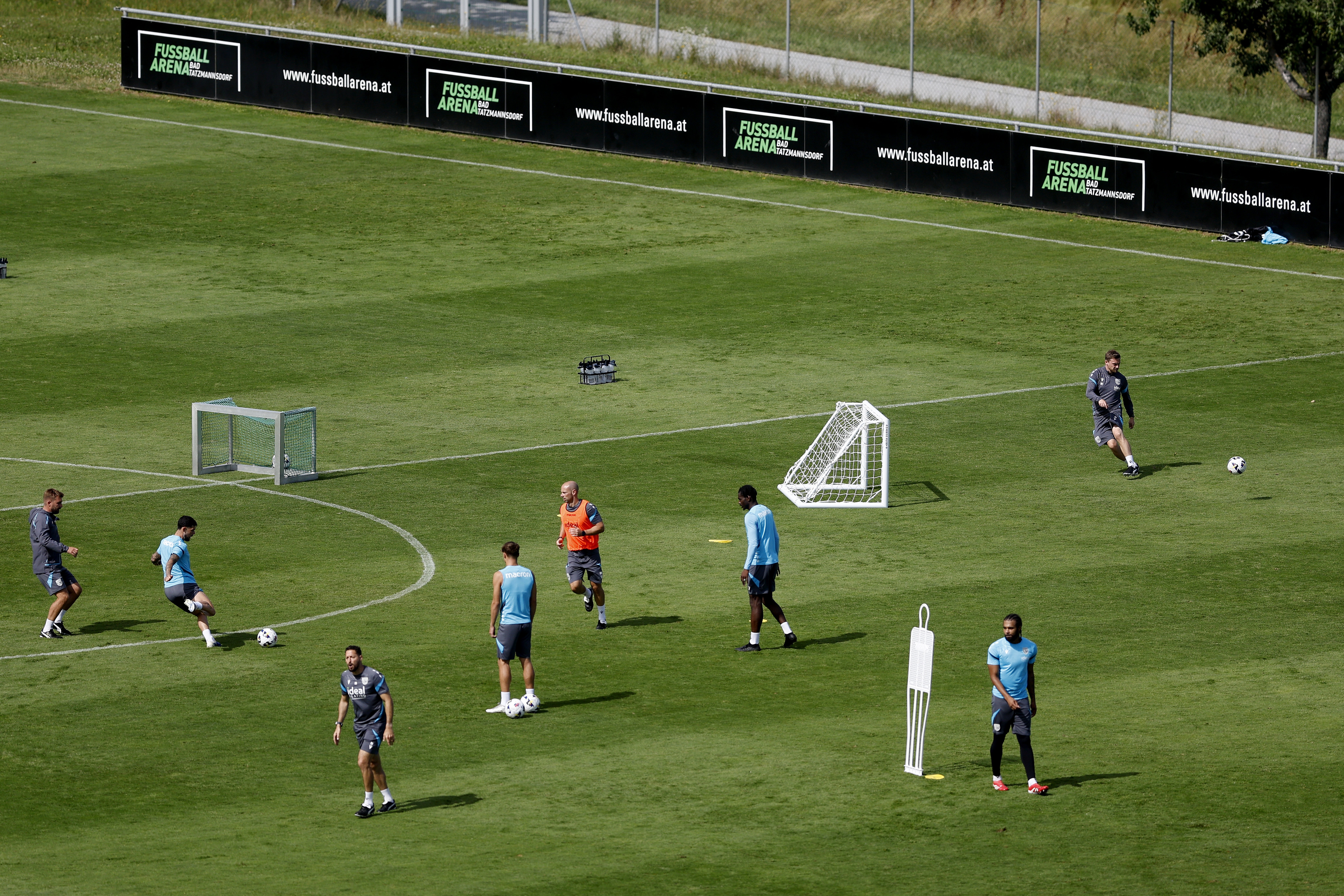 A general view of training from a vantage point with the pitch at the bottom of the hills