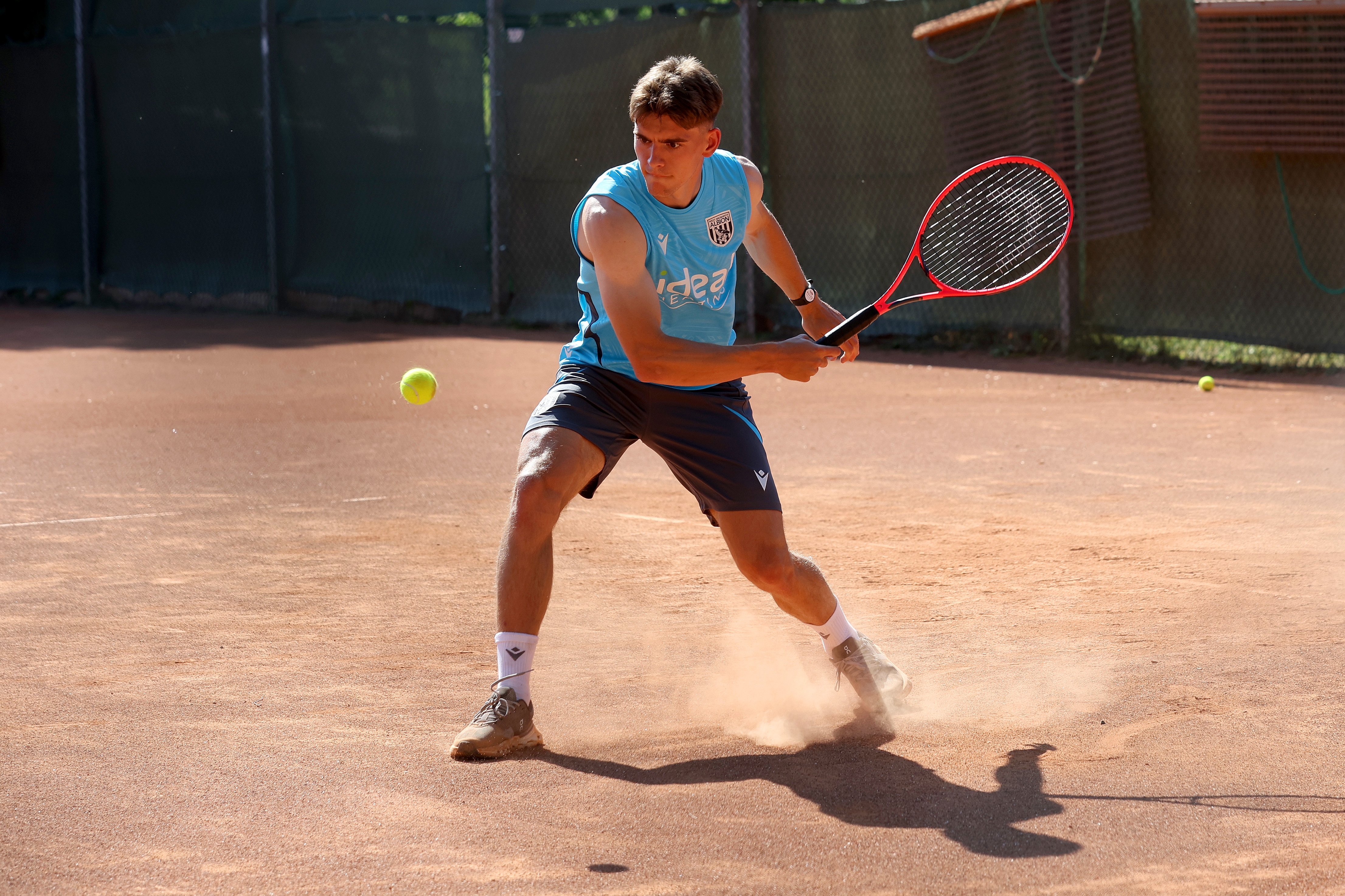 Tom Fellows playing tennis 