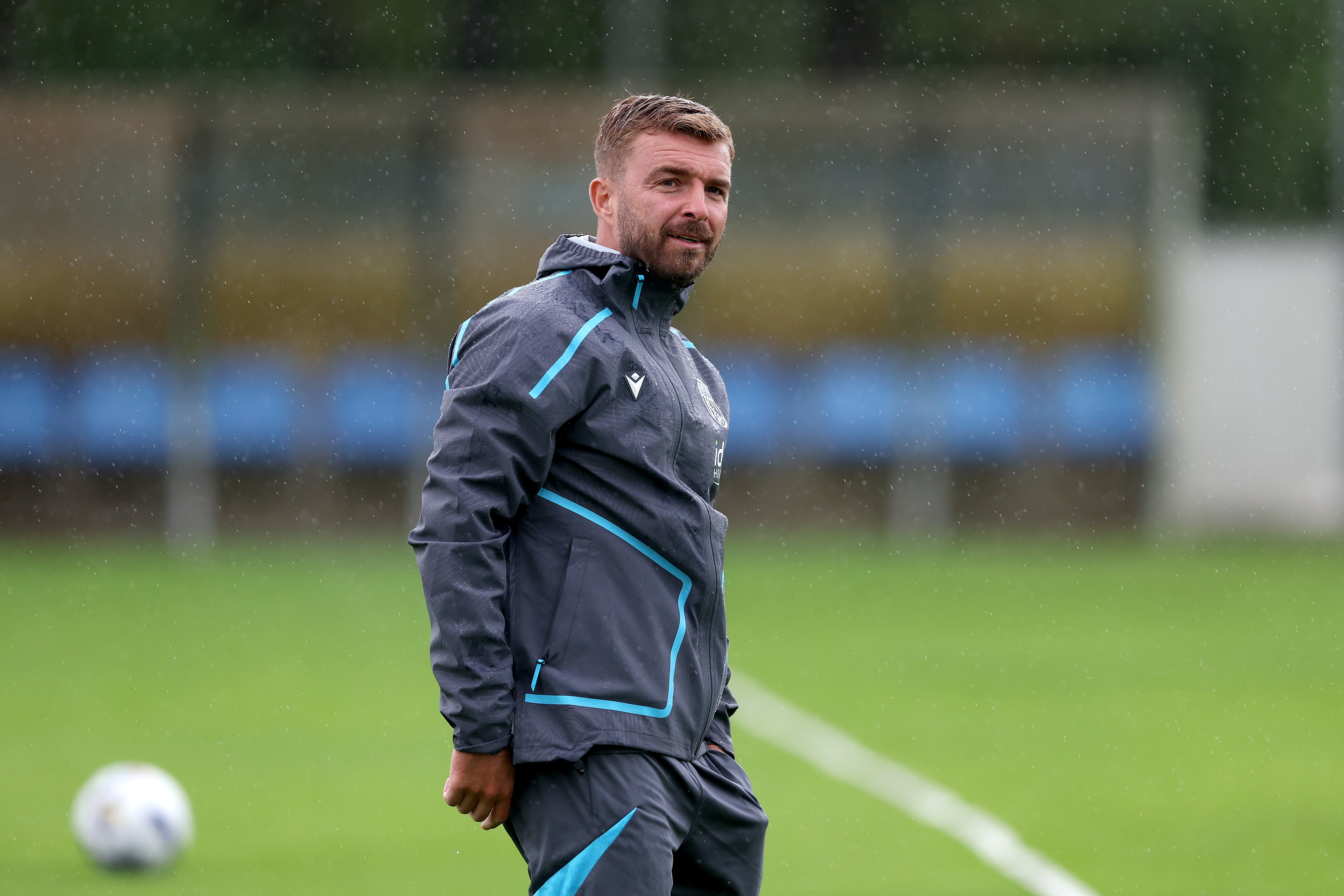 James Morrison smiling during a training session in the rain