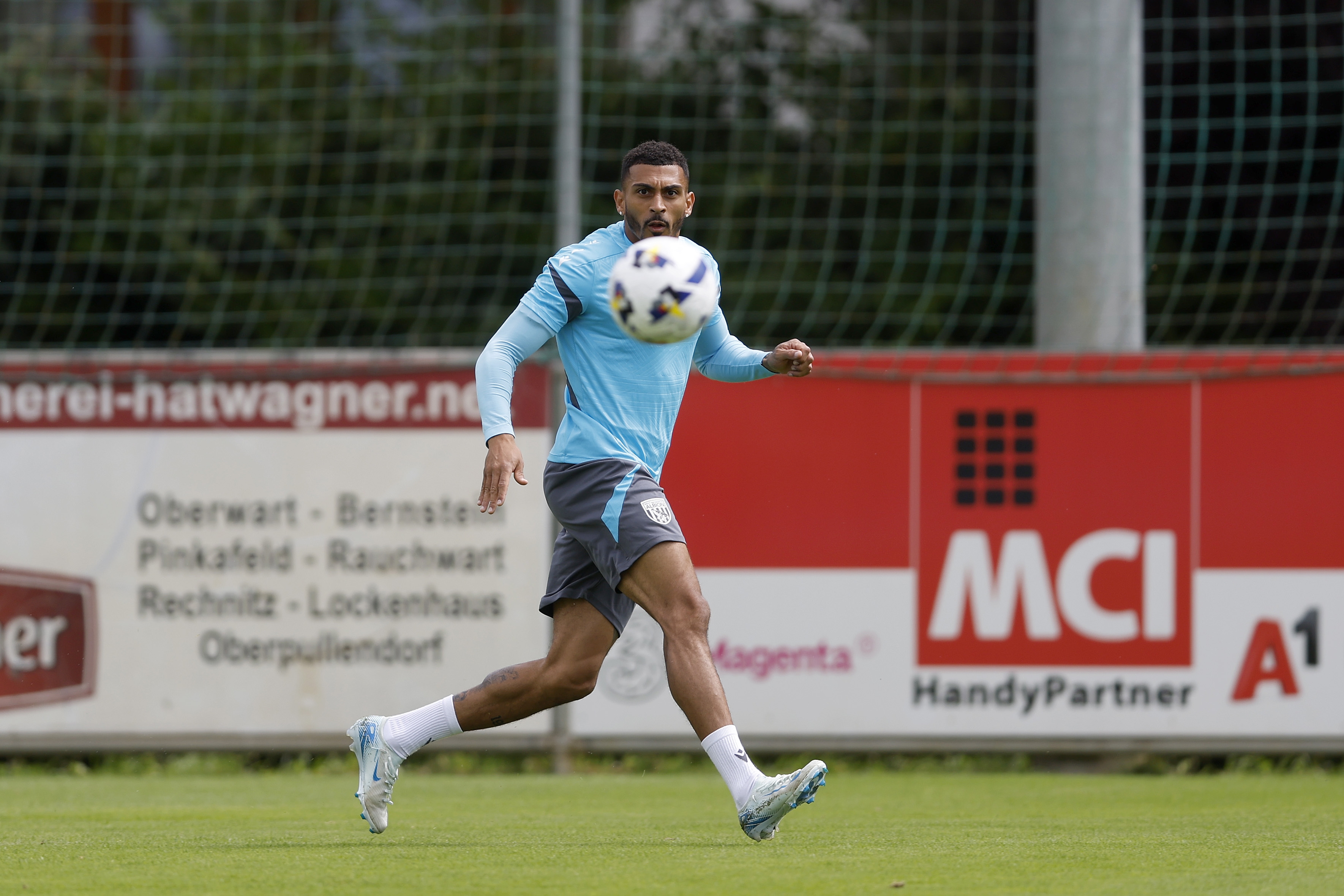 Karlan Grant watching the ball during a training session in Austria 