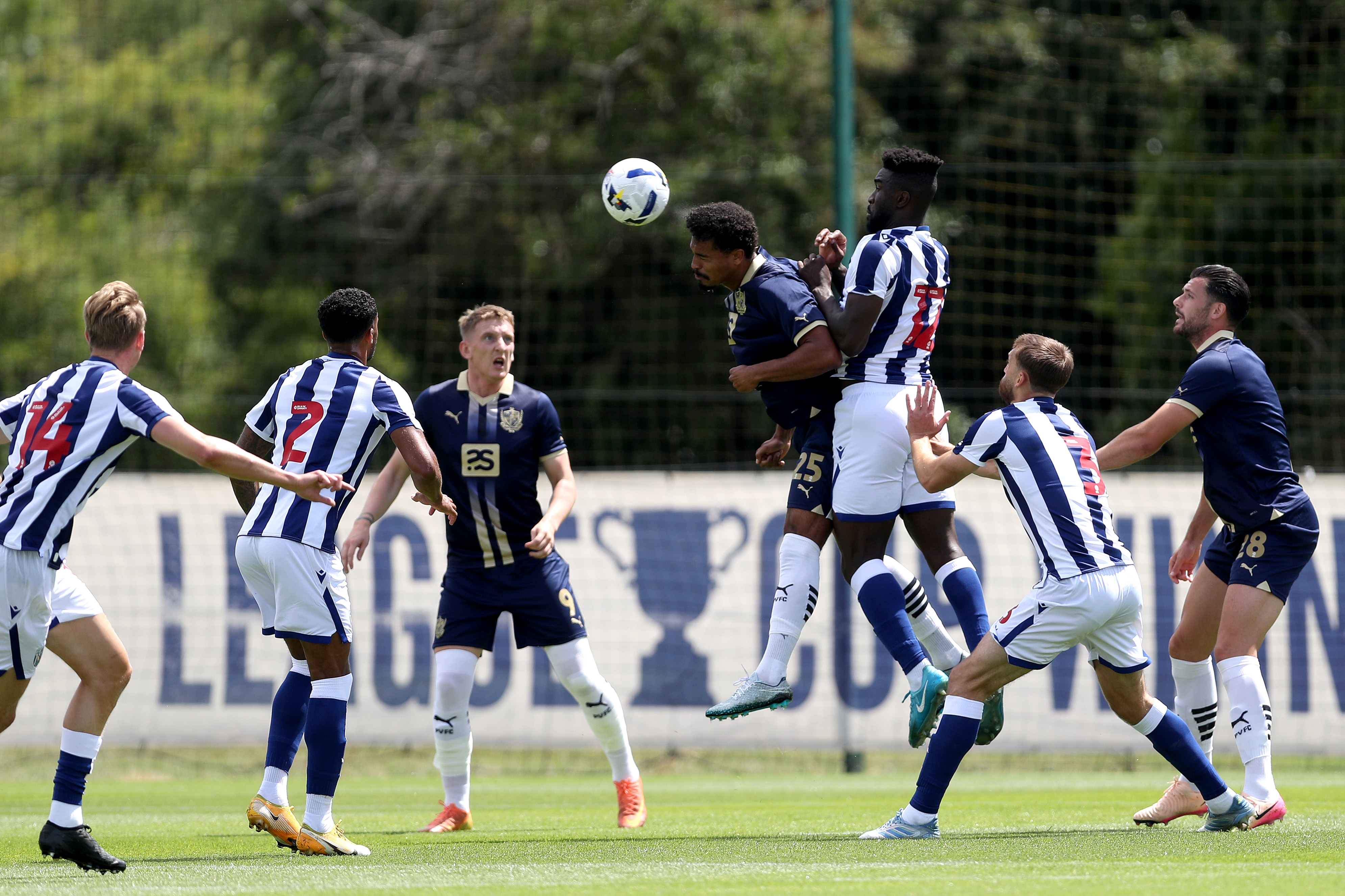 General match action with several players in shot of WBA v Port Vale 