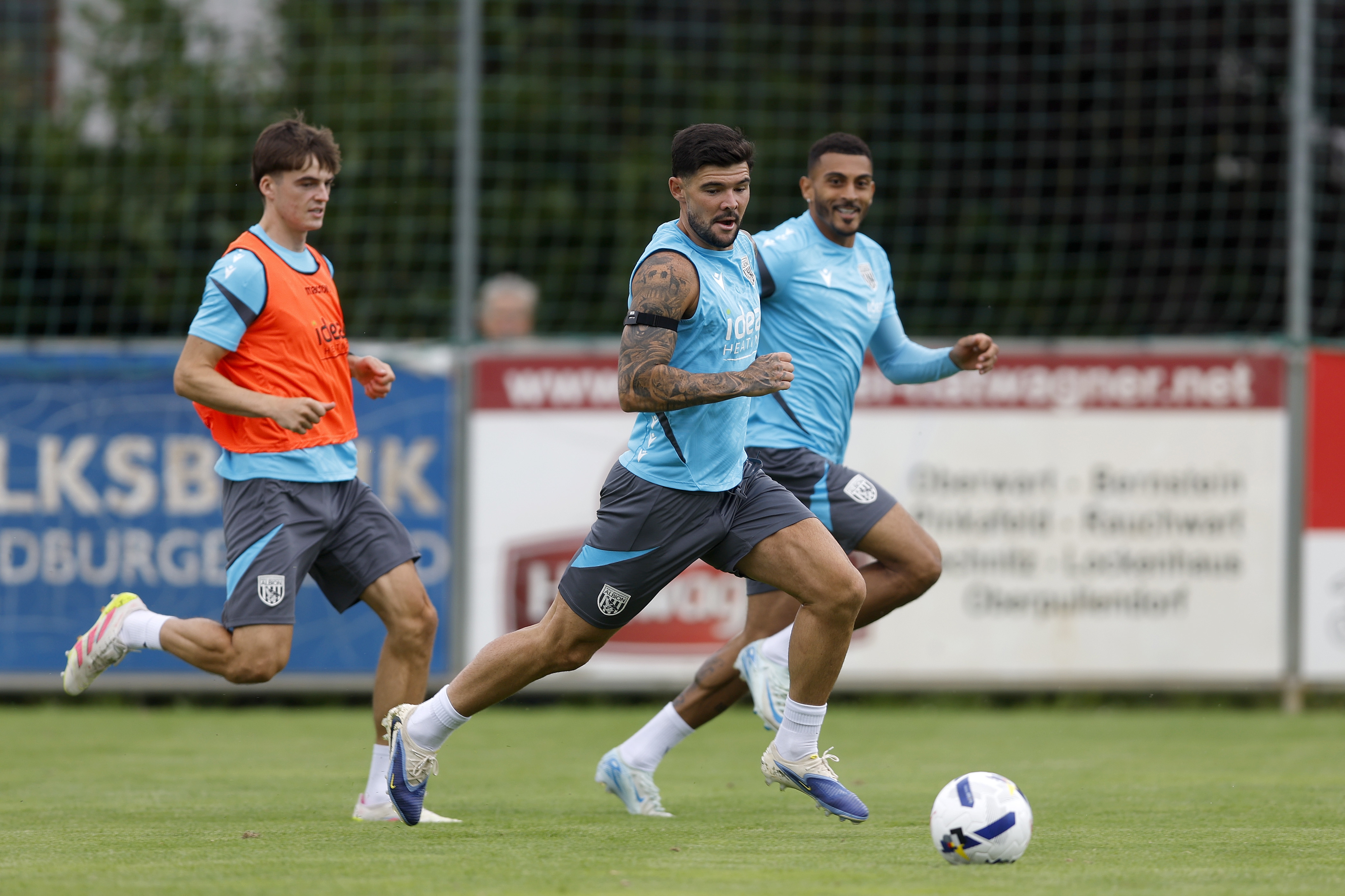 Alex Mowatt on the ball during a training session in Austria with Alex Williams and Karlan Grant behind him