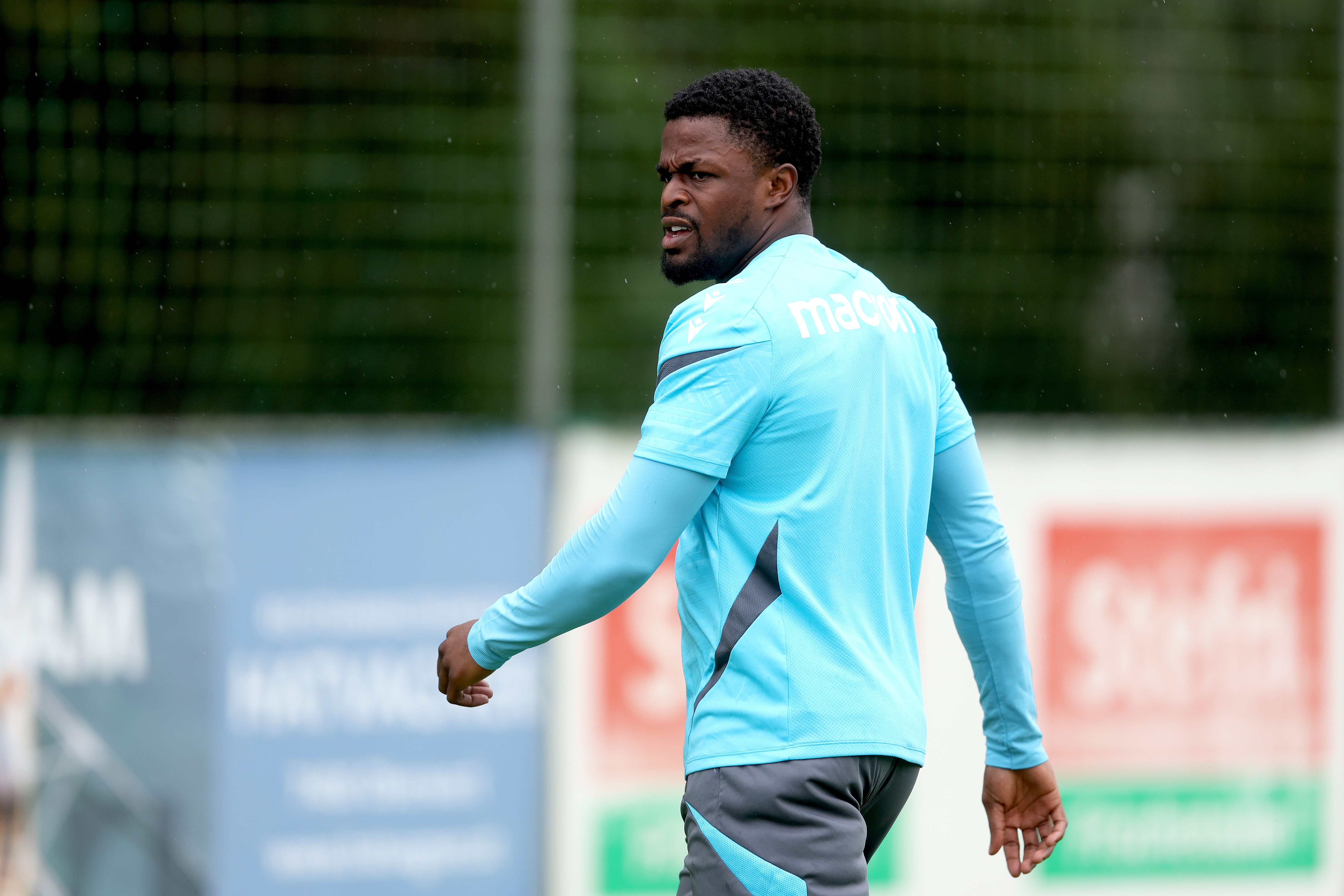 Josh Maja looking to the side during a training session in the rain