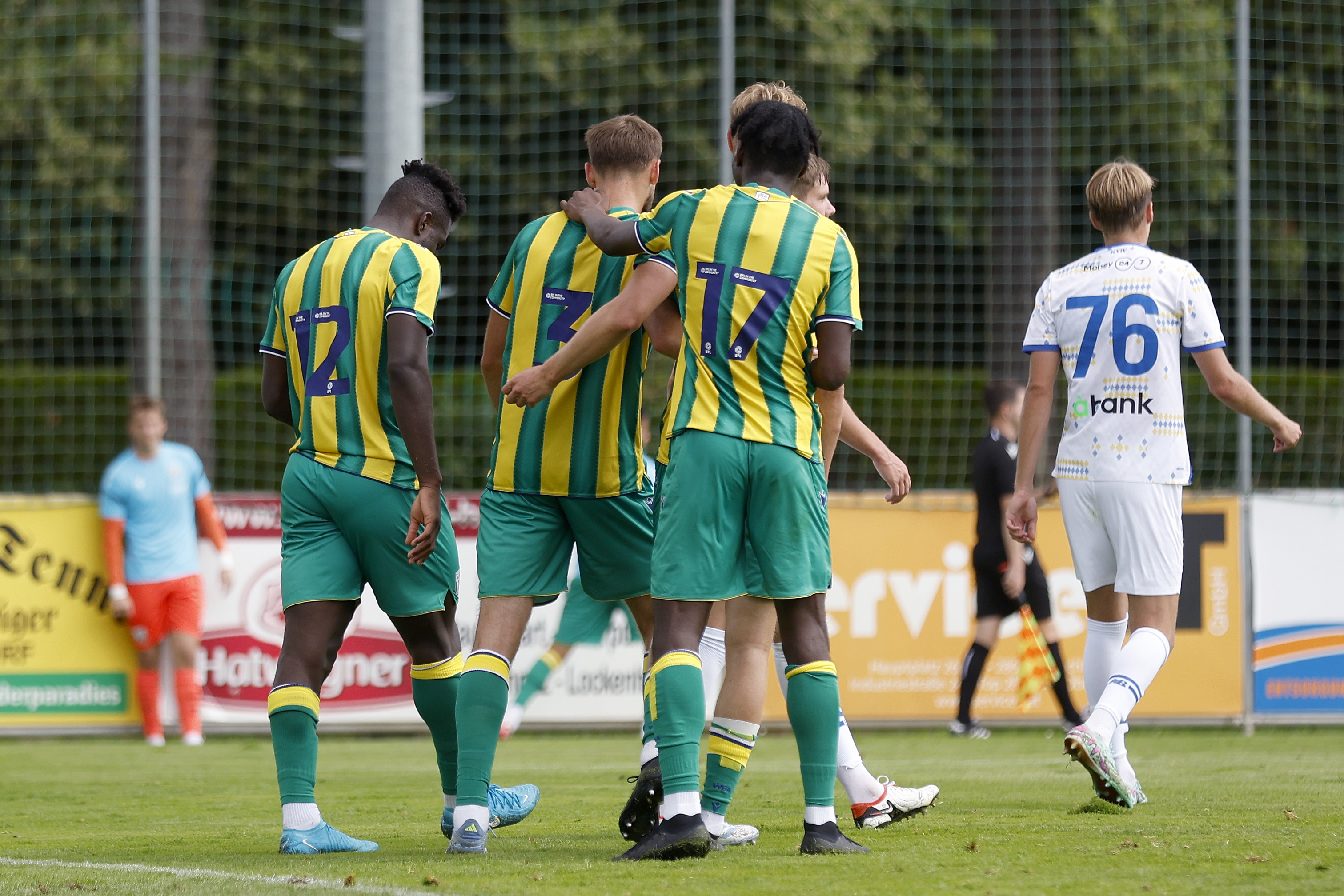 Nat Phillips celebrates with Daryl Dike and Ousmane Diakité after scoring against Dynamo Kyiv 