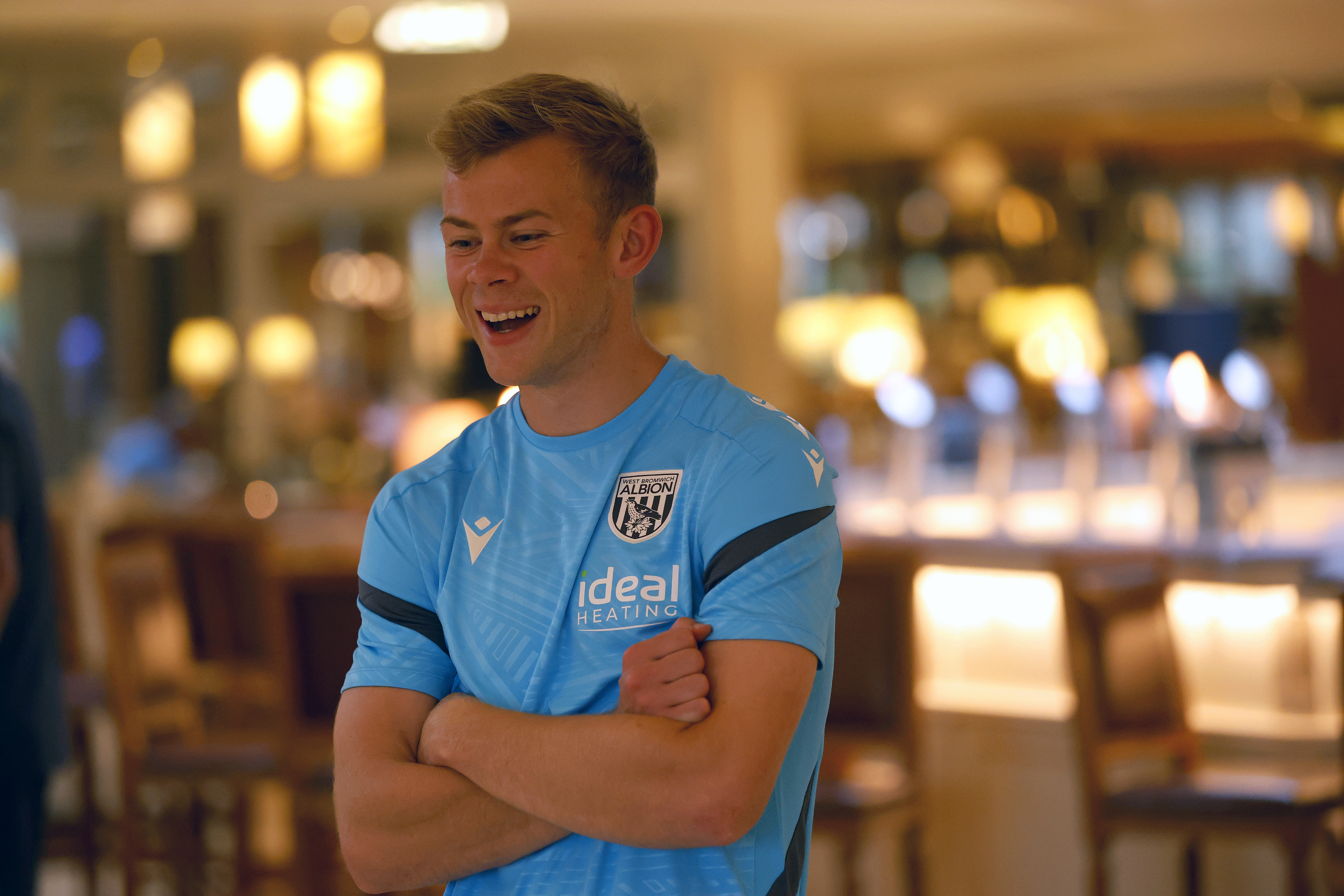 Aune Heggebø smiling with his arms folded 