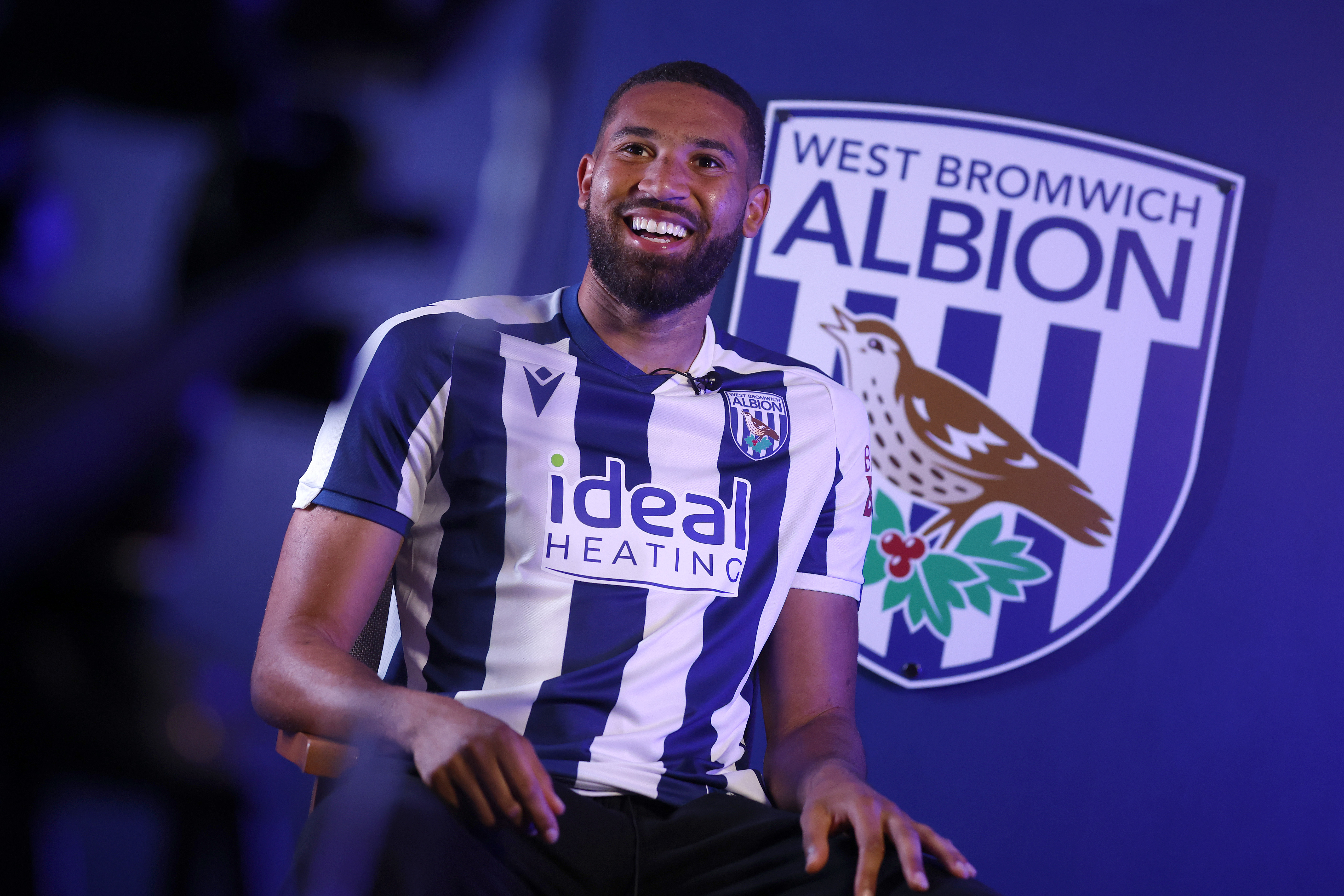 George Campbell smiling while sat in a WBA home shirt and being interviewed by WBA TV