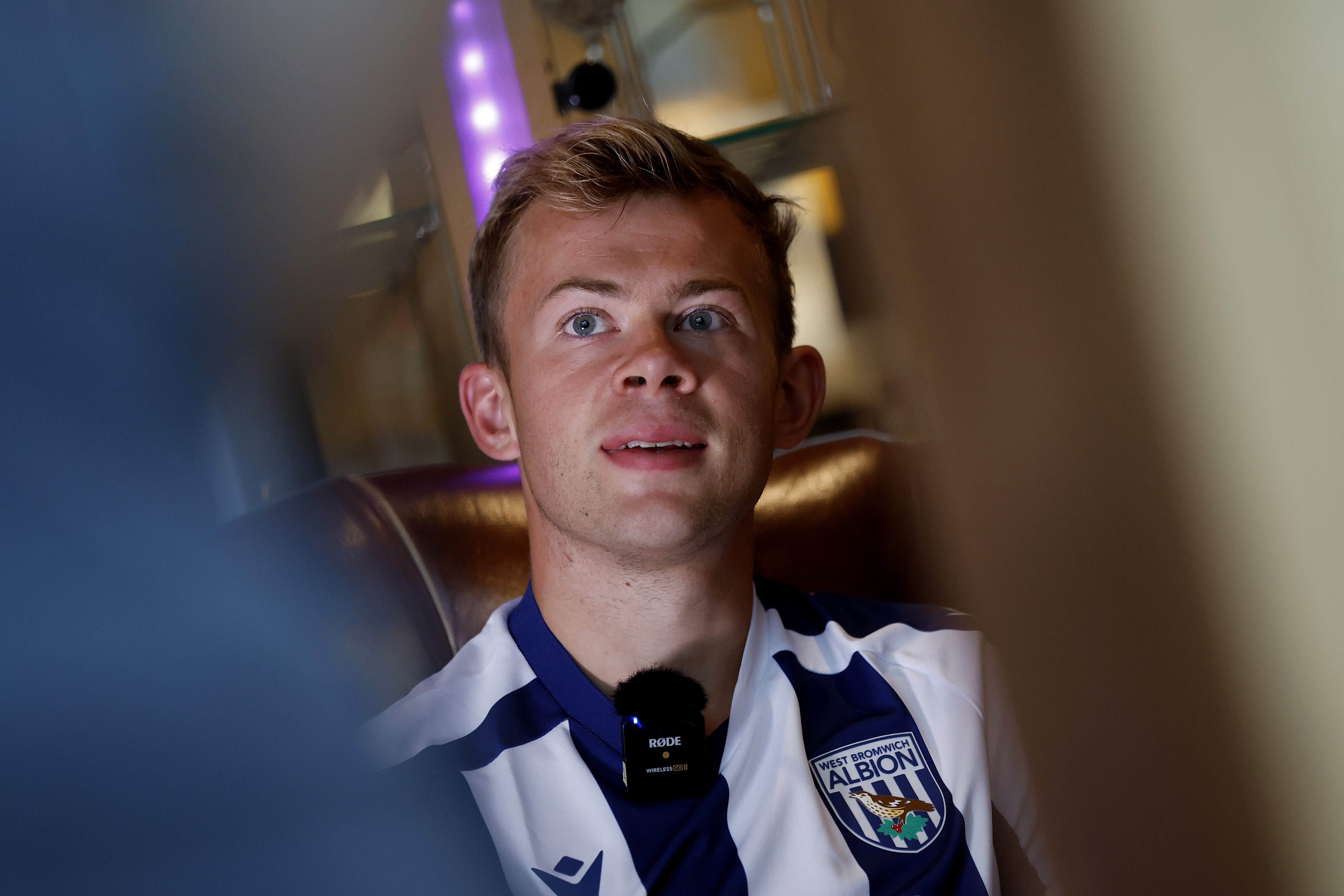 Aune Heggebø smiling while sat in a WBA shirt