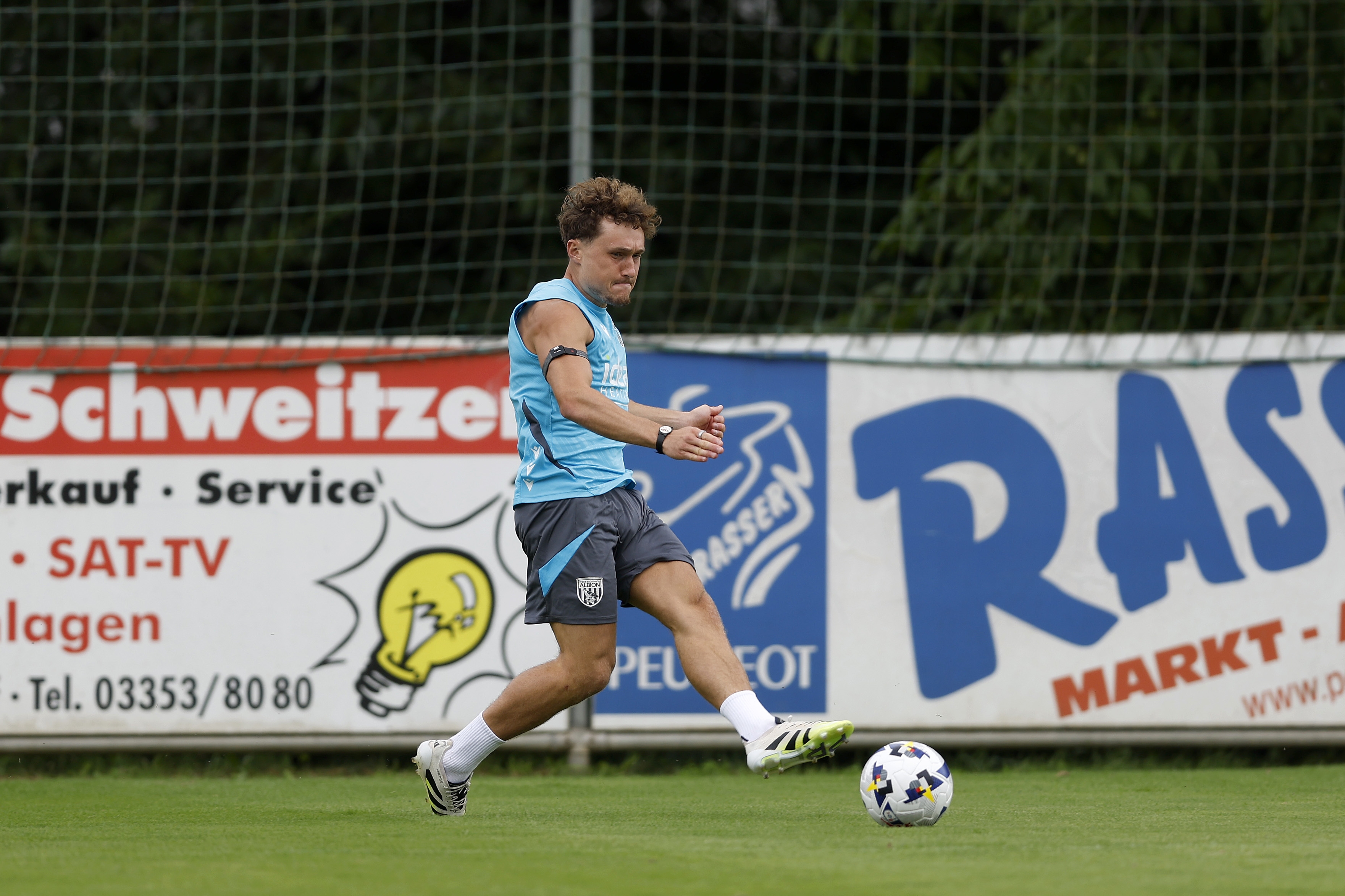 Callum Styles crossing the ball during a training session in Austria