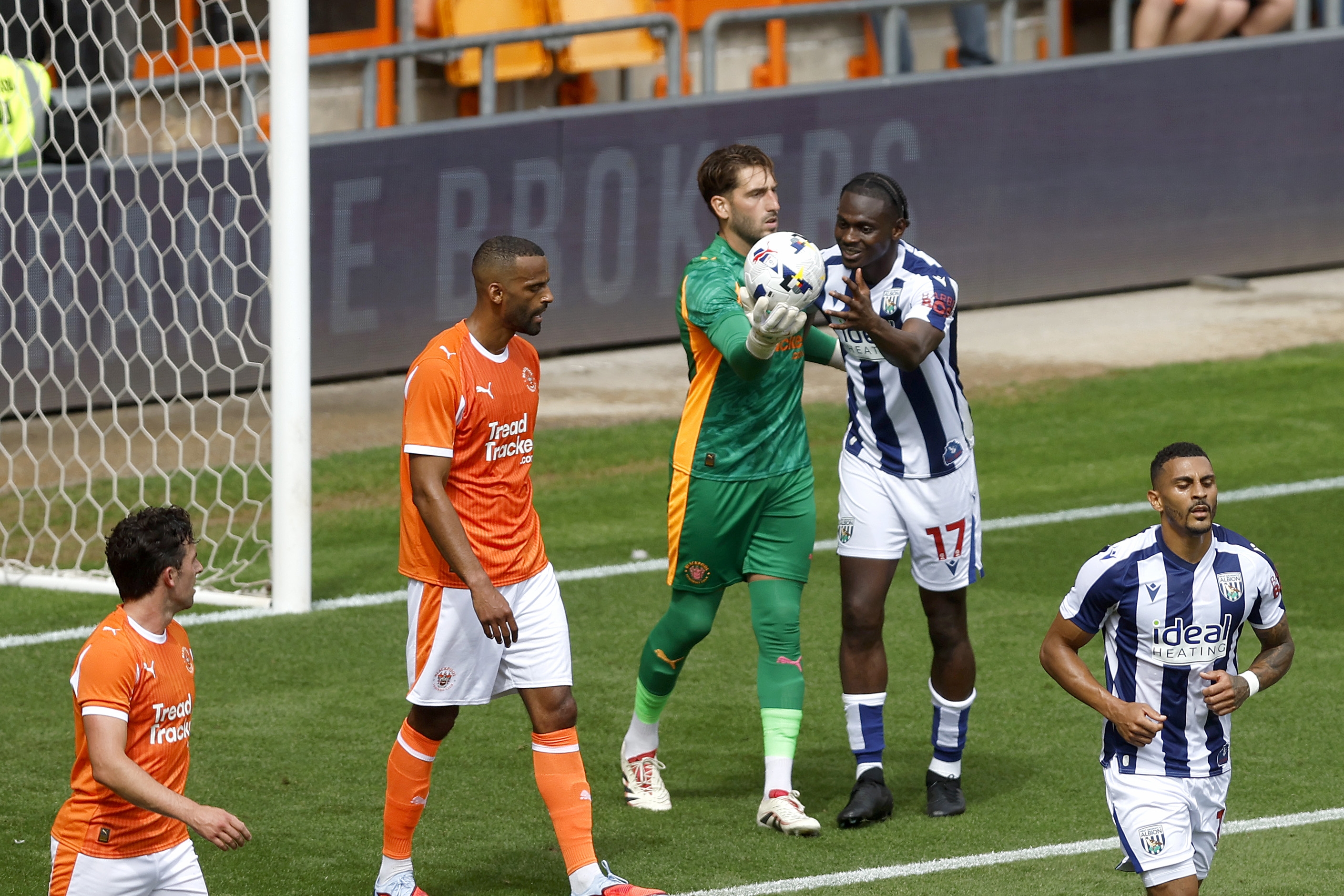 Ousmane Diakité trying to get the ball off the Blackpool goalkeeper