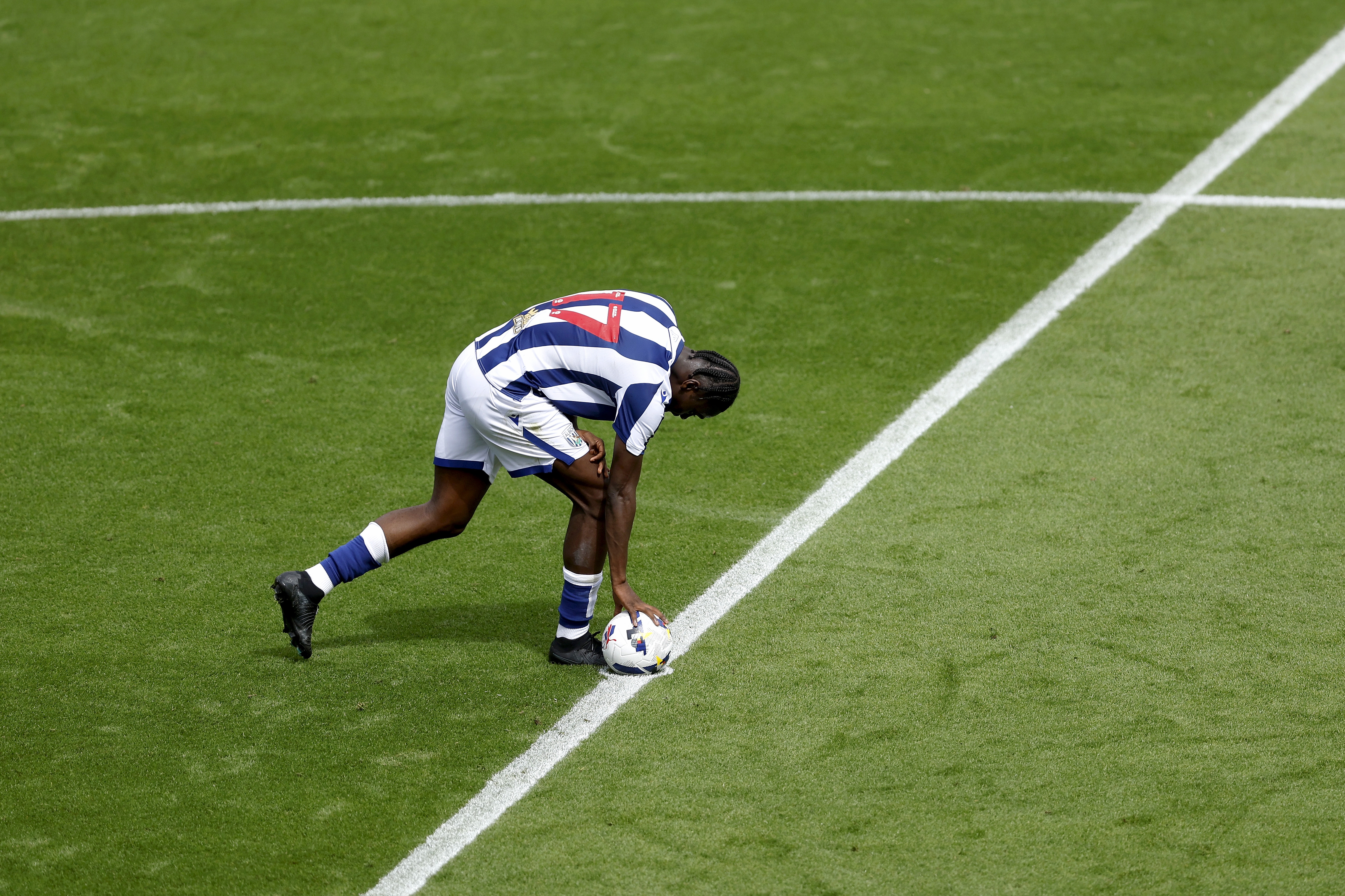 Ousmane Diakité placing the ball on the centre circle after scoring at Blackpool