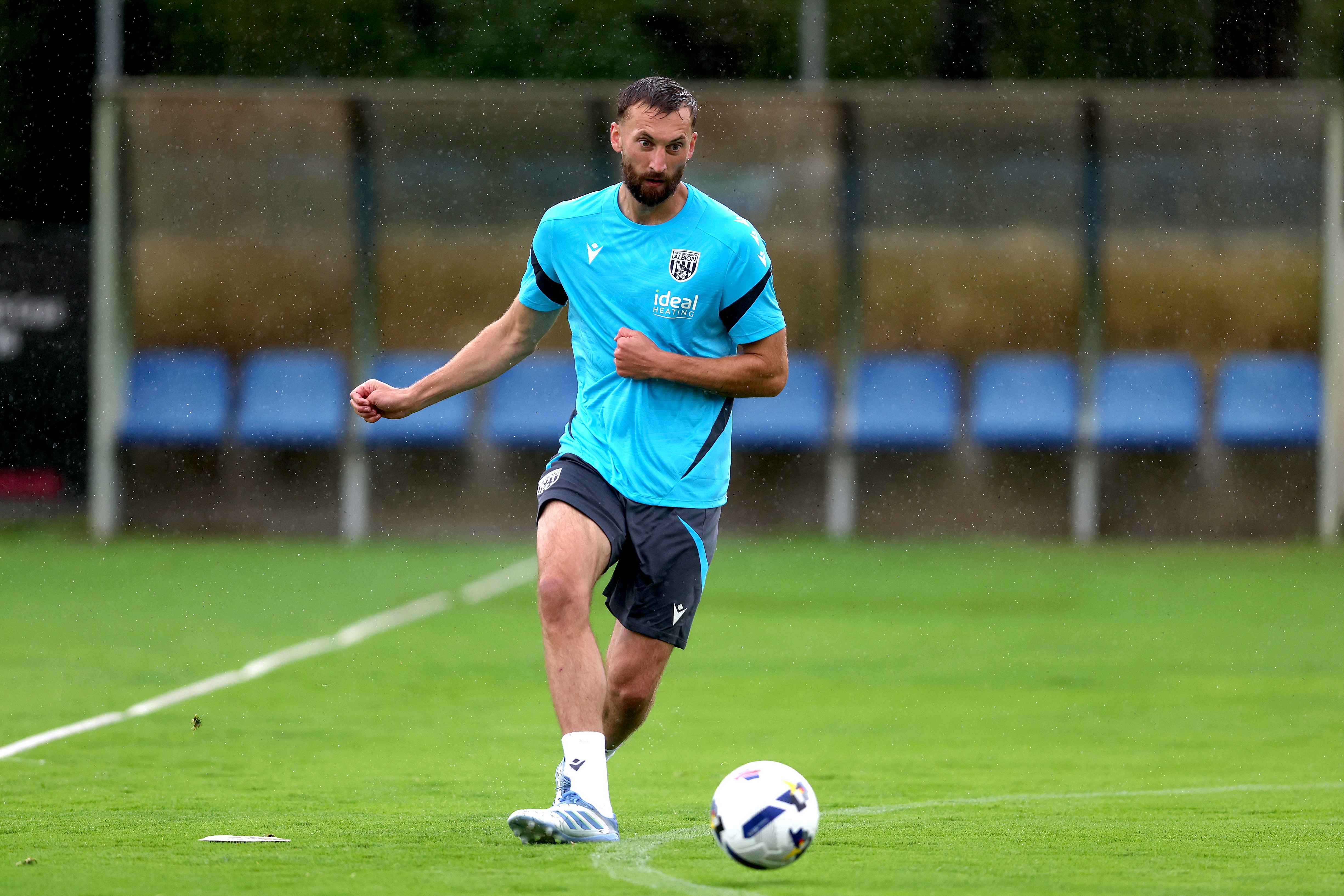 Nat Phillips on the ball during a training session in the rain