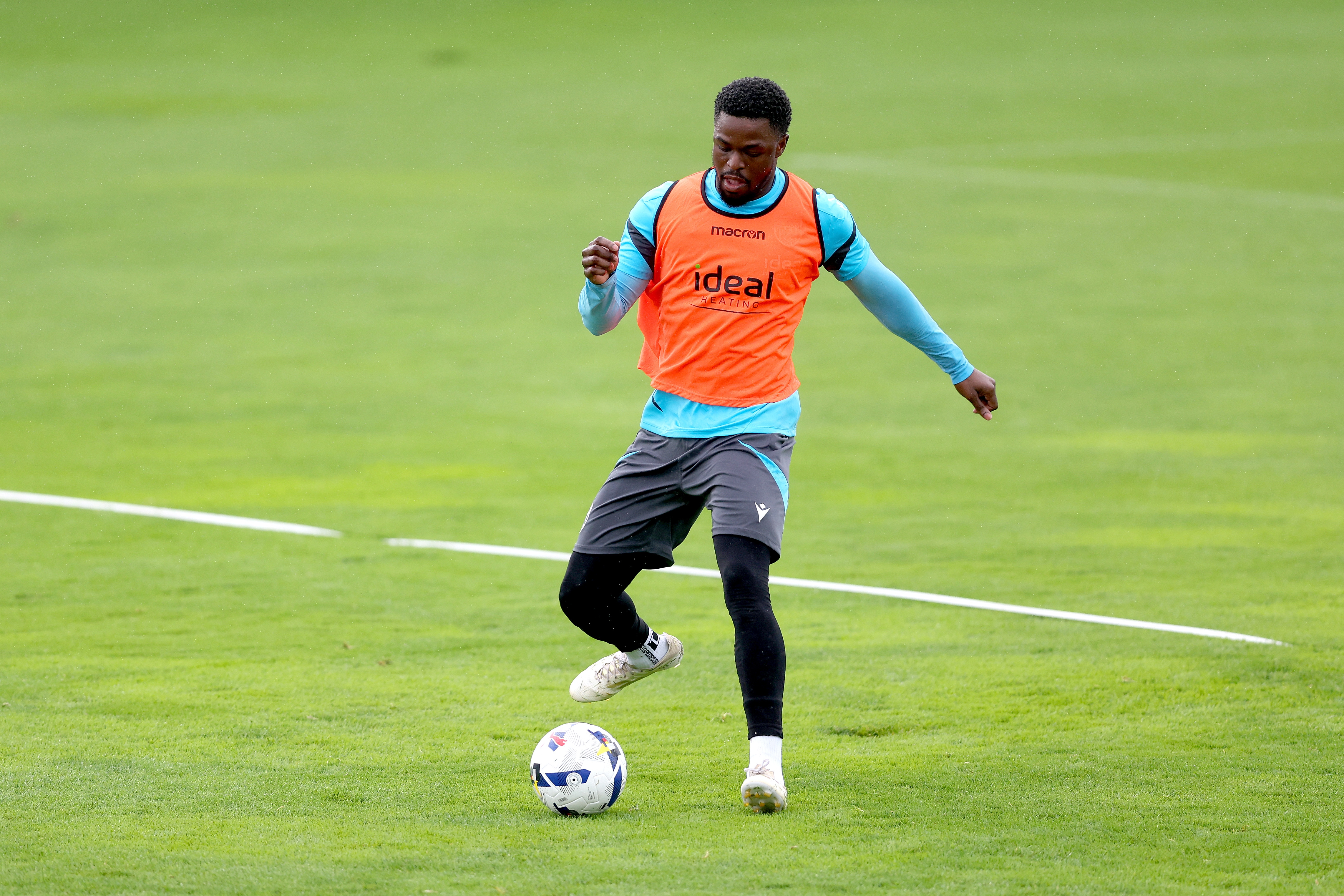Josh Maja on the ball during a training session in the rain
