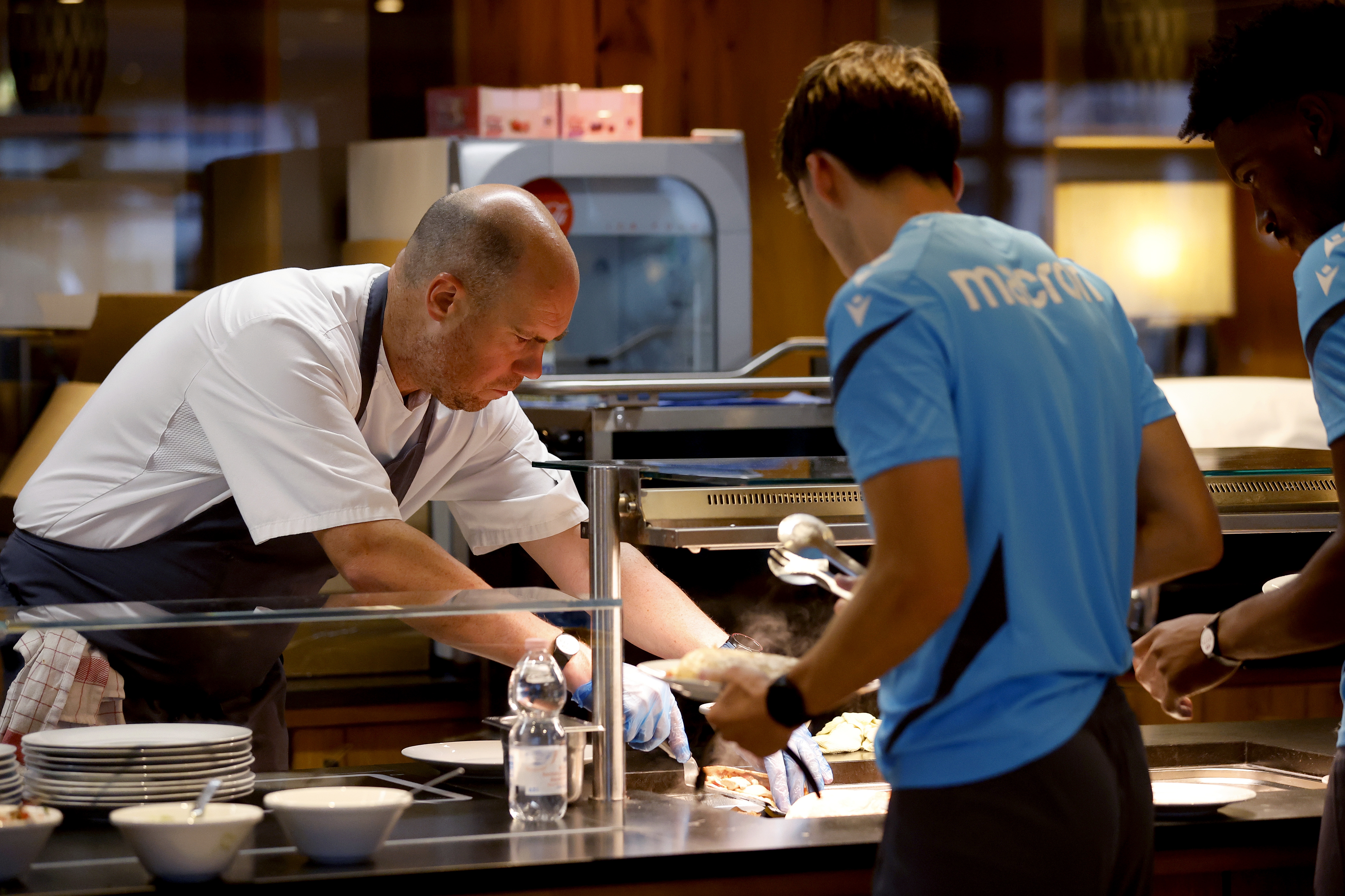 A WBA chef preparing food for a player at the hotel