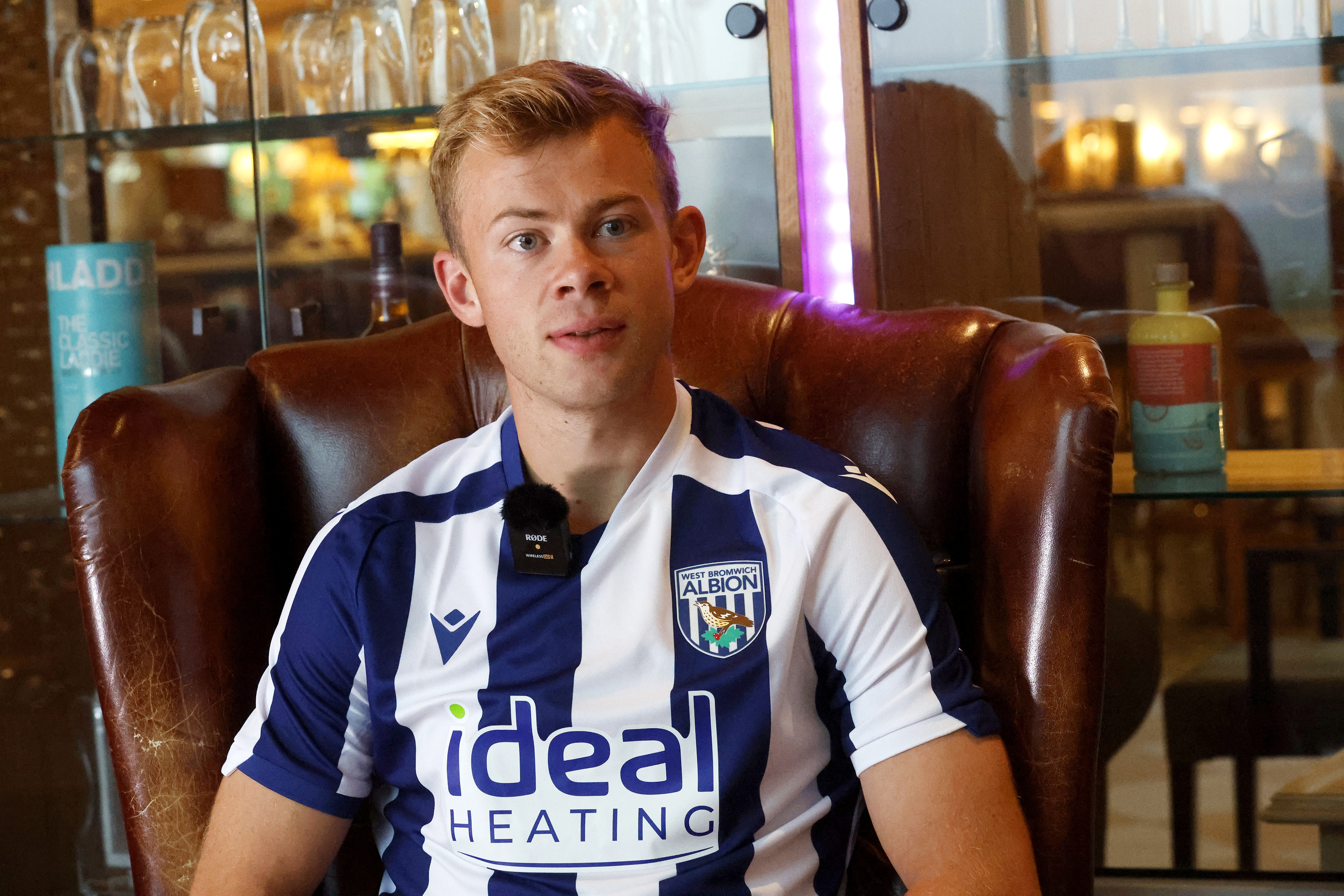 Aune Heggebø sat in a WBA shirt in a chair being interviewed by WBA TV
