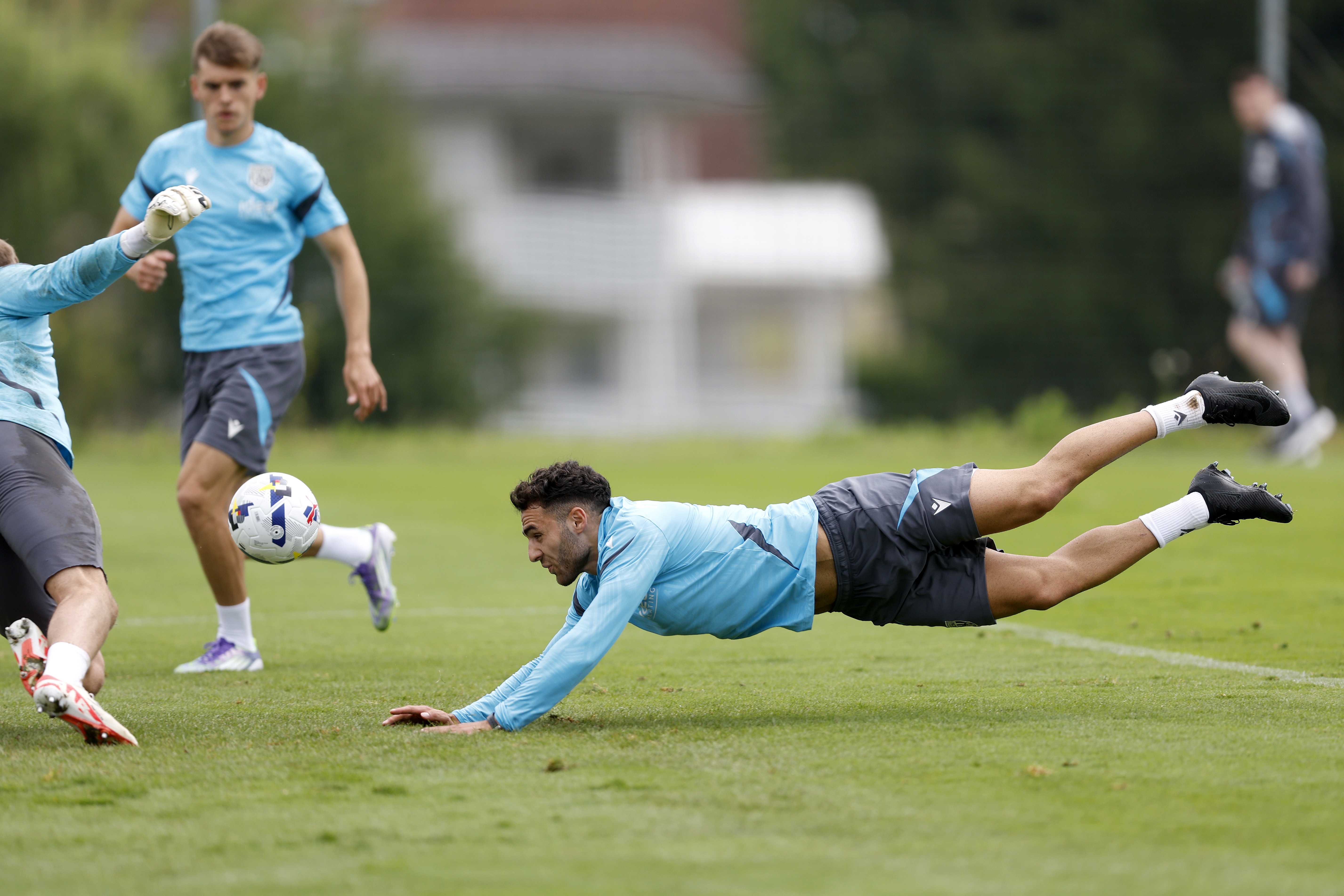 Tammer Bany diving for a header during training