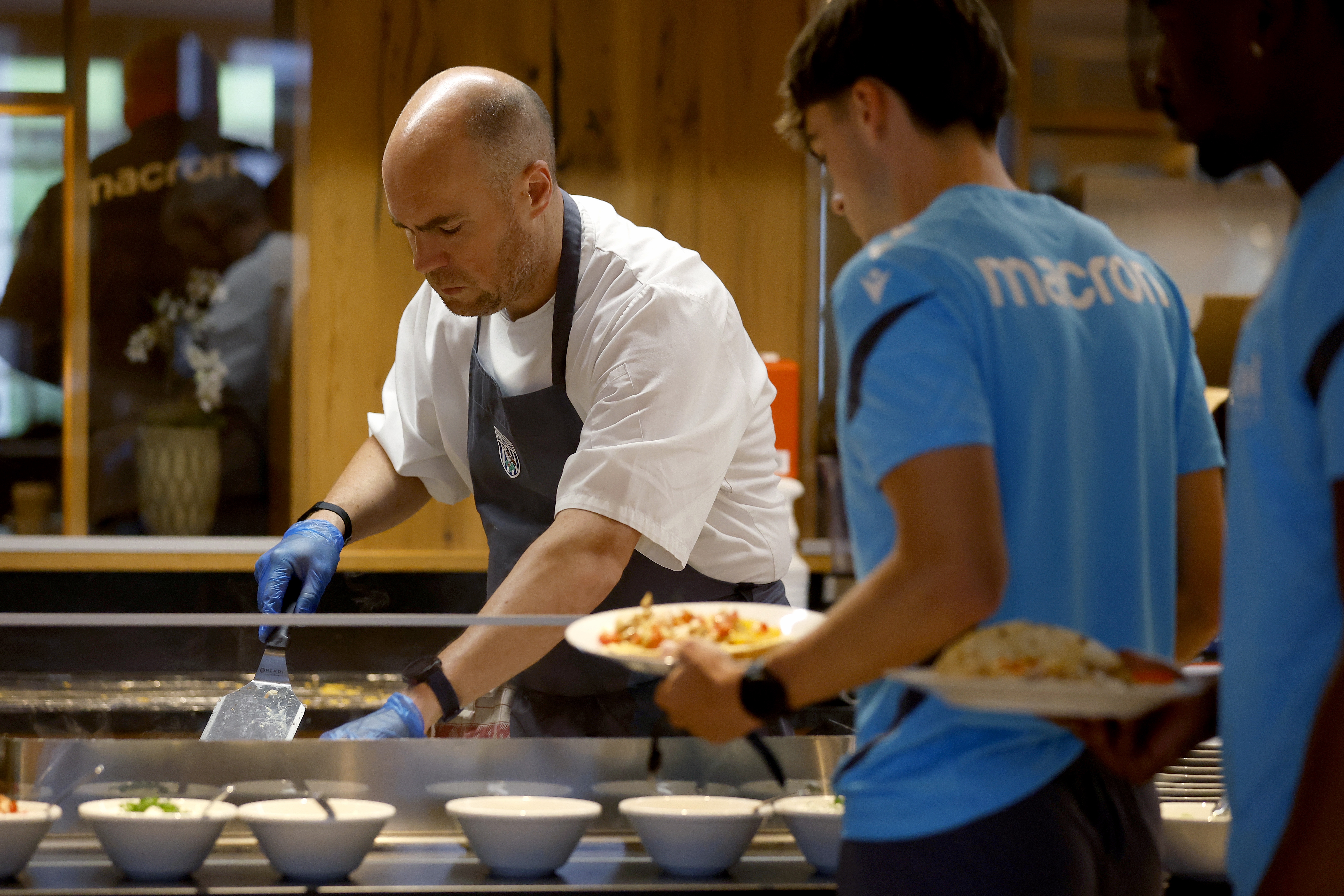 A WBA chef preparing food for a player at the hotel