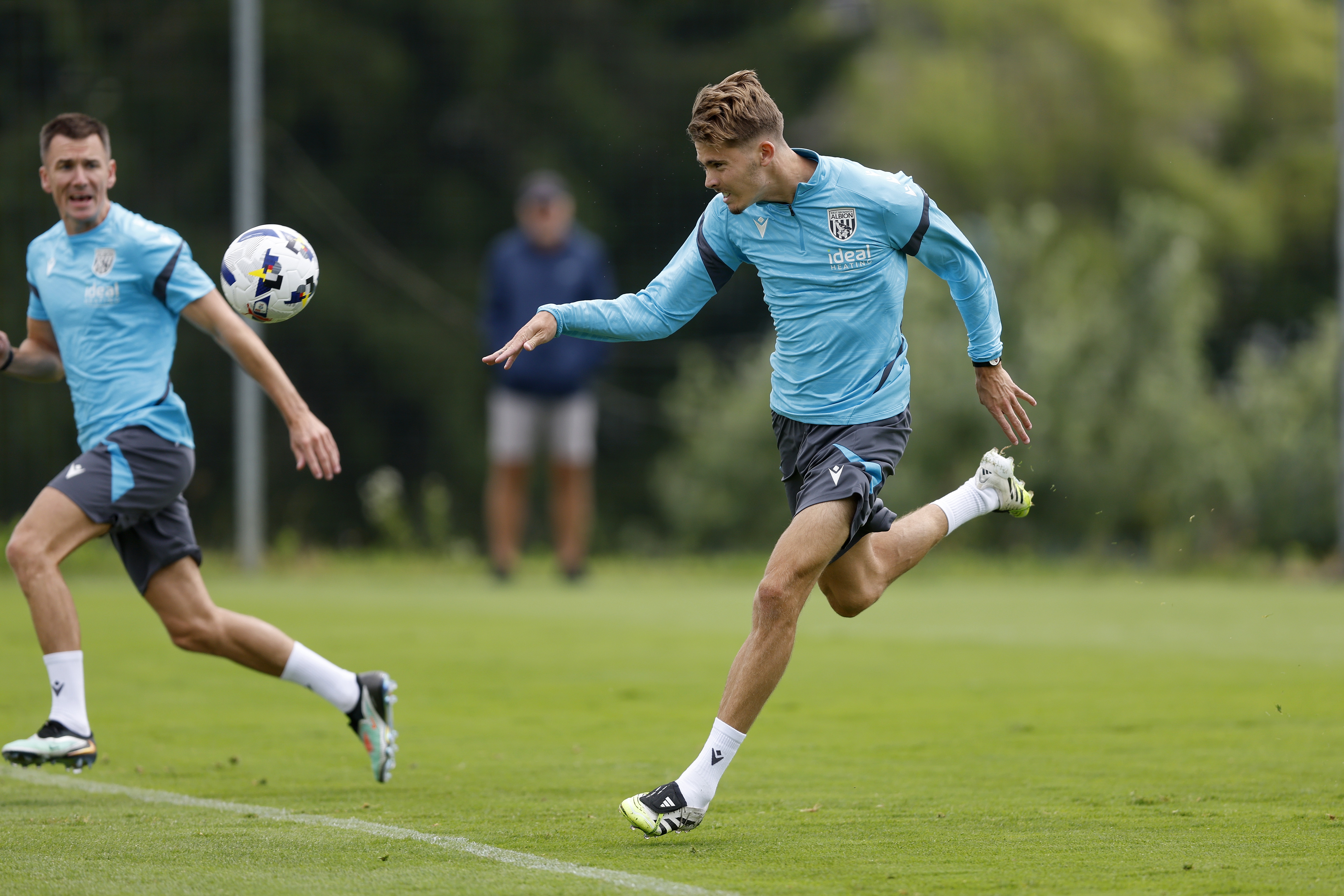 Isaac Price heading the ball during training