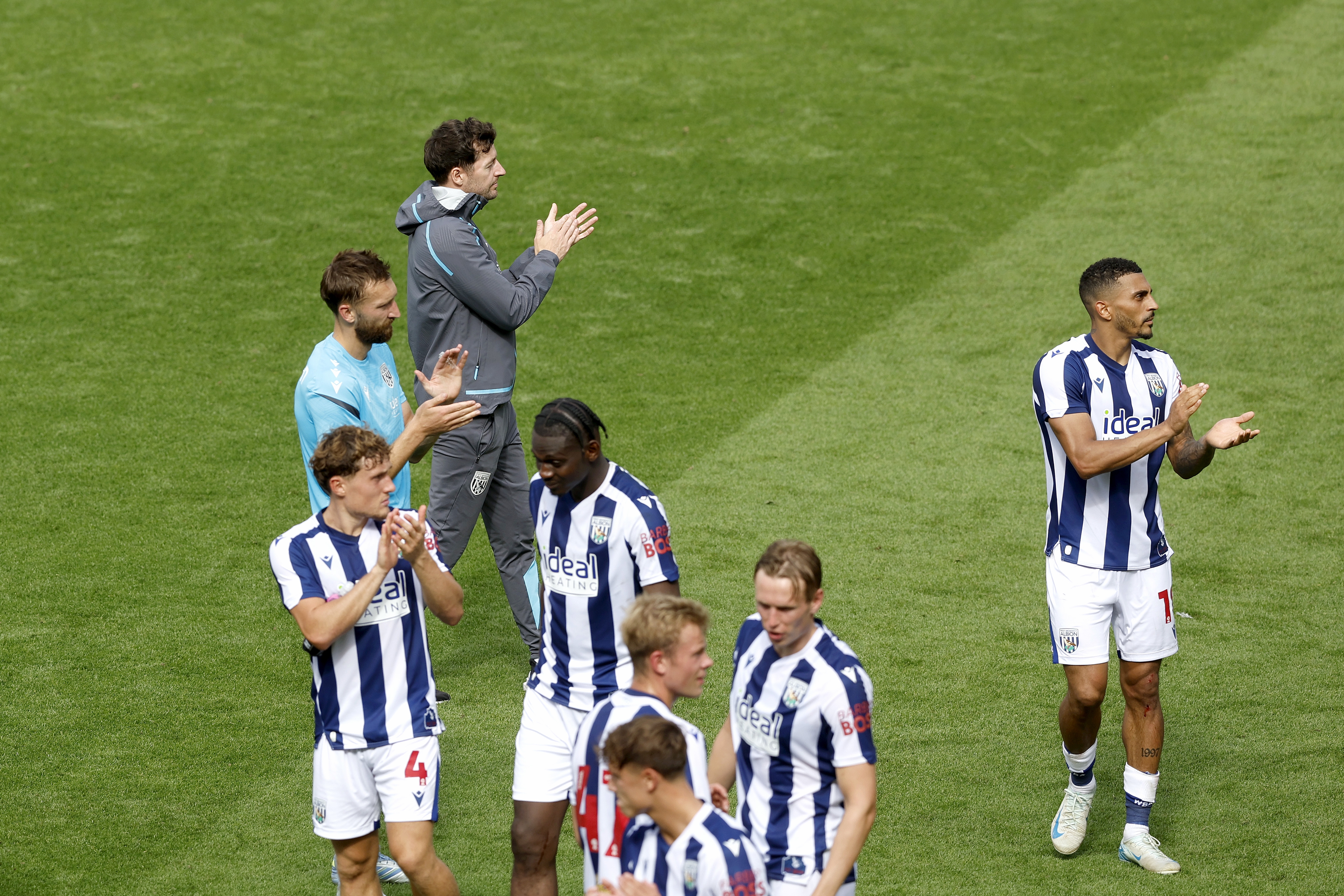 Ryan Mason and Albion players applaud WBA fans after the Blackpool game