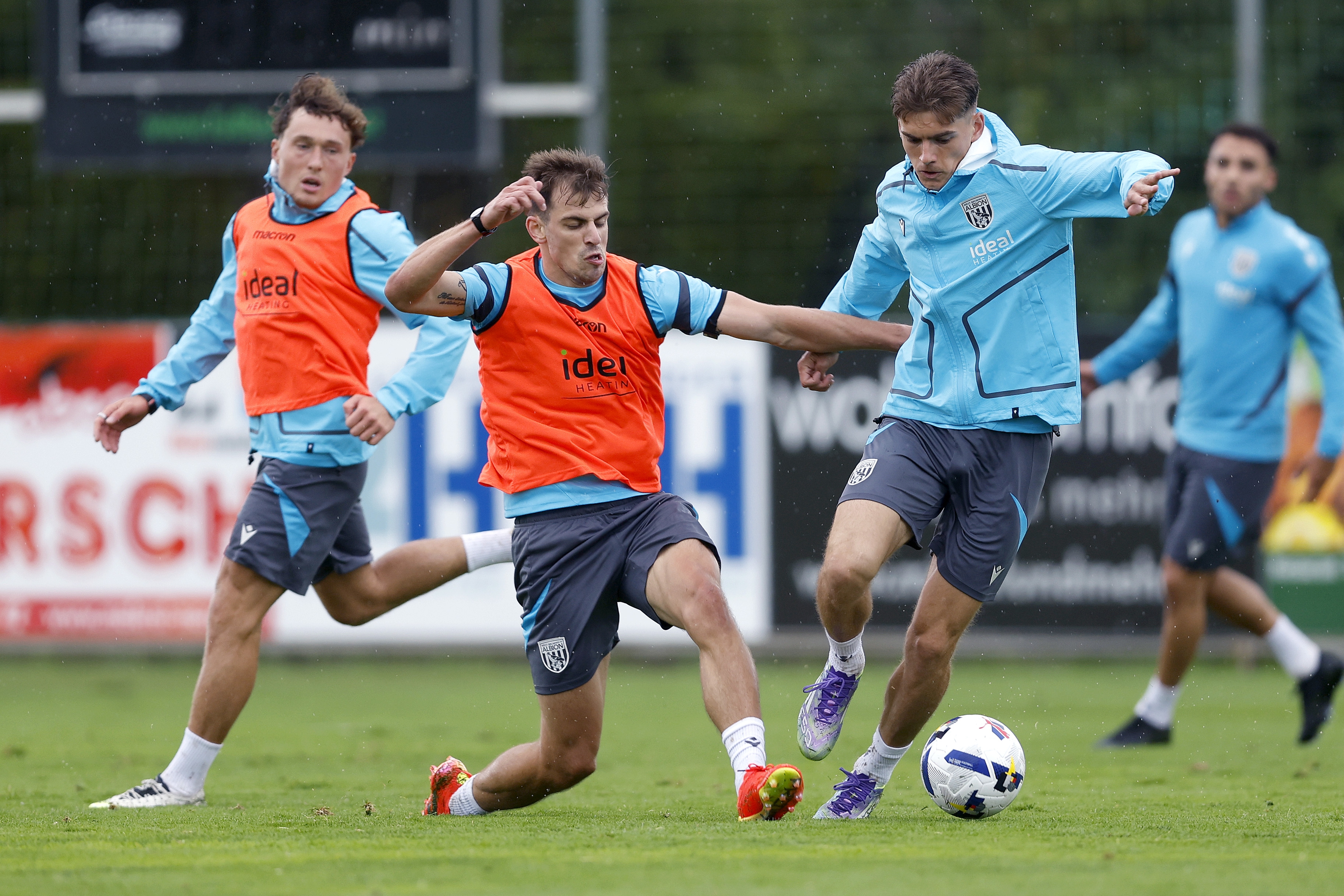 Jayson Molumby and Tom Fellows fight for the ball during a training session in Austria 