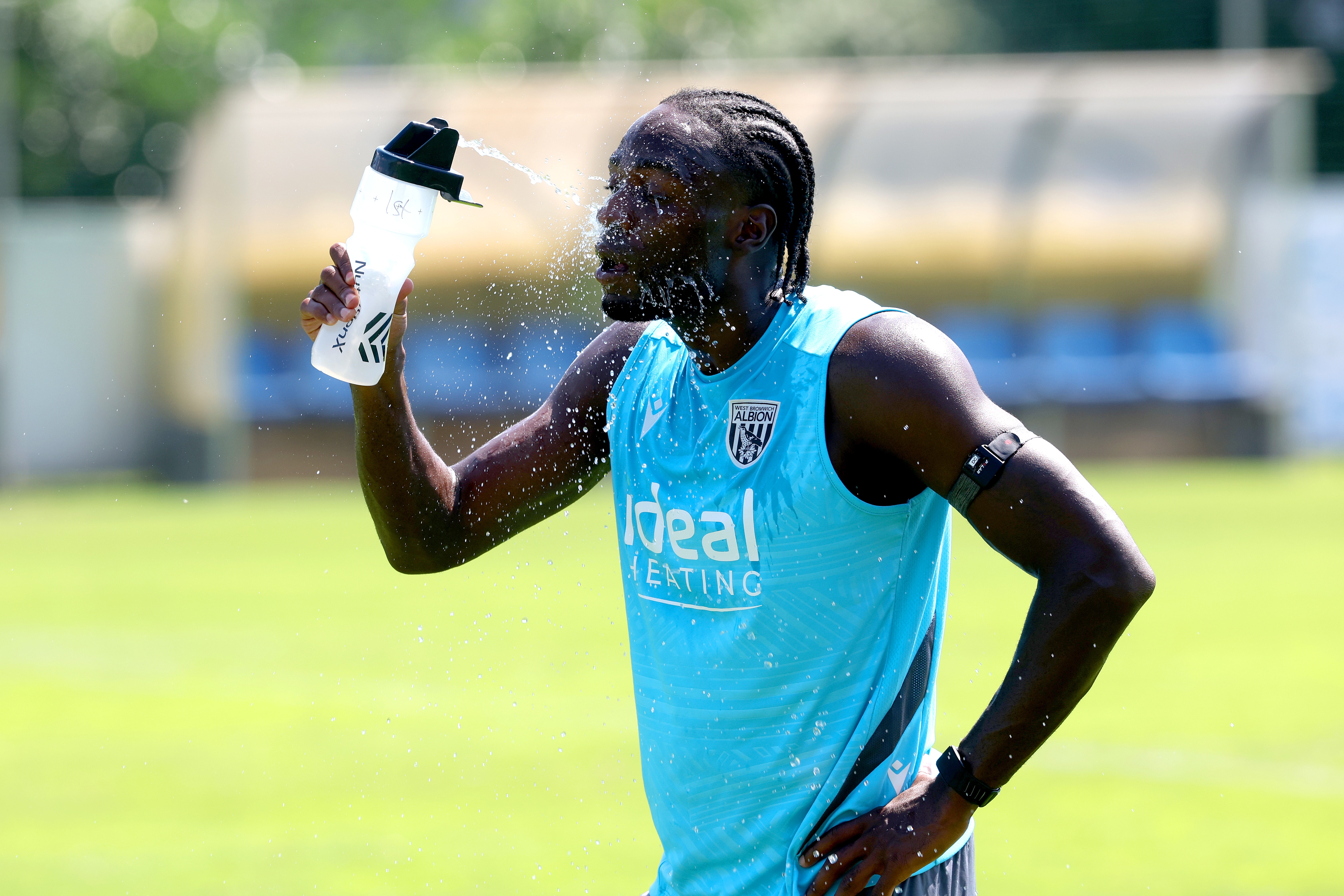 Devante Cole squirting water in his face