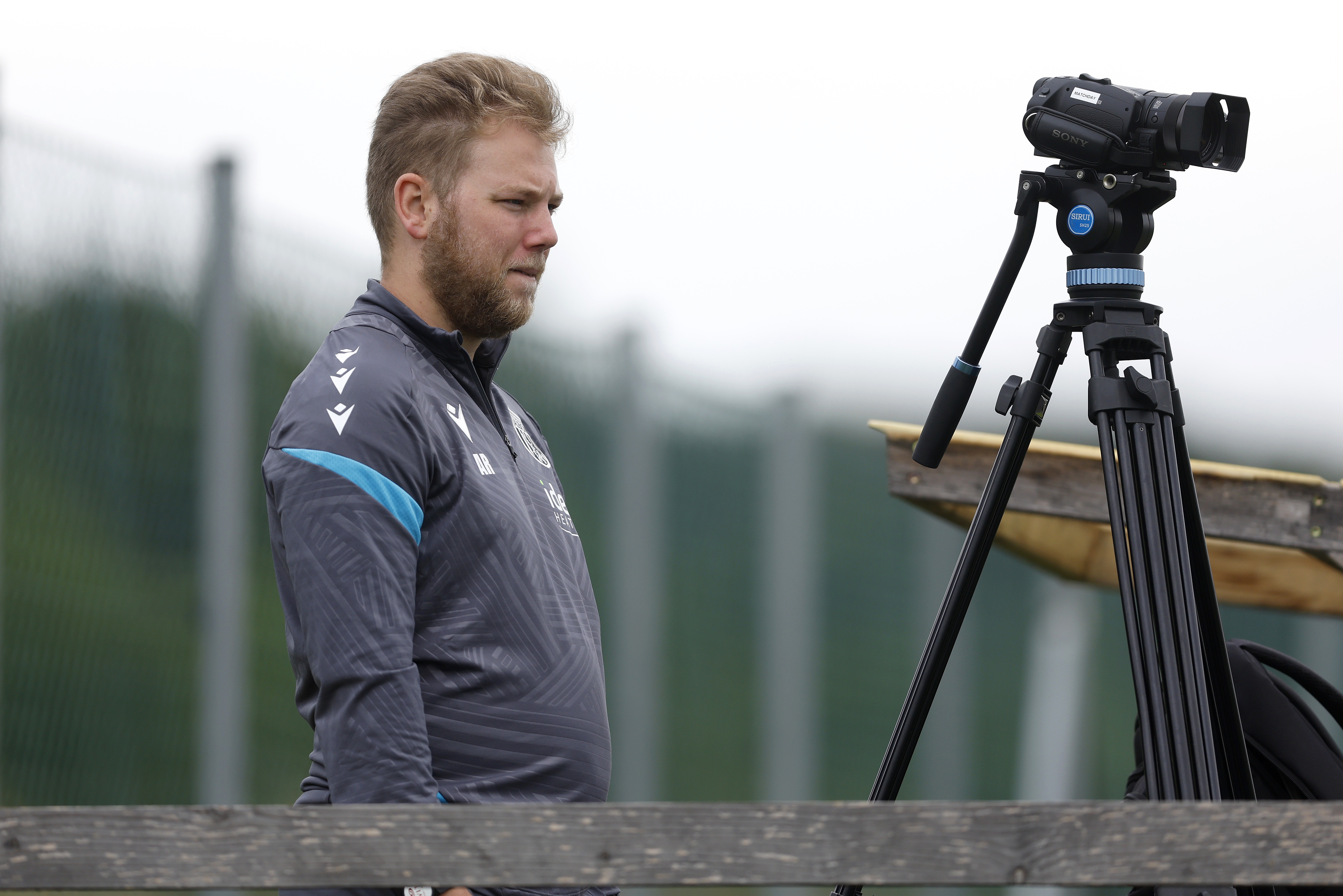 Albion analyst Aaron Rymer filming training with a camera 