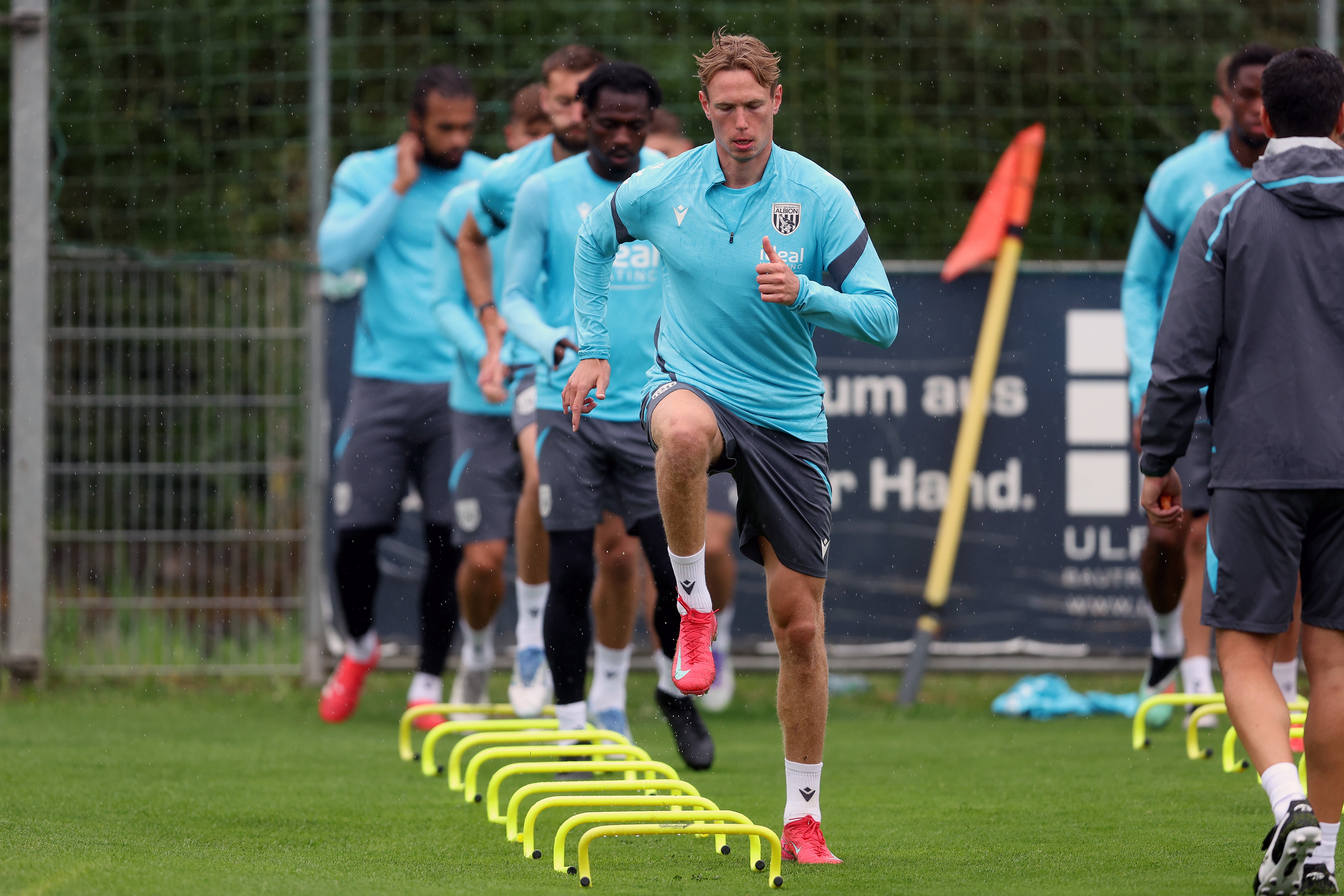 Torbjørn Heggem warming up before a training session in the rain