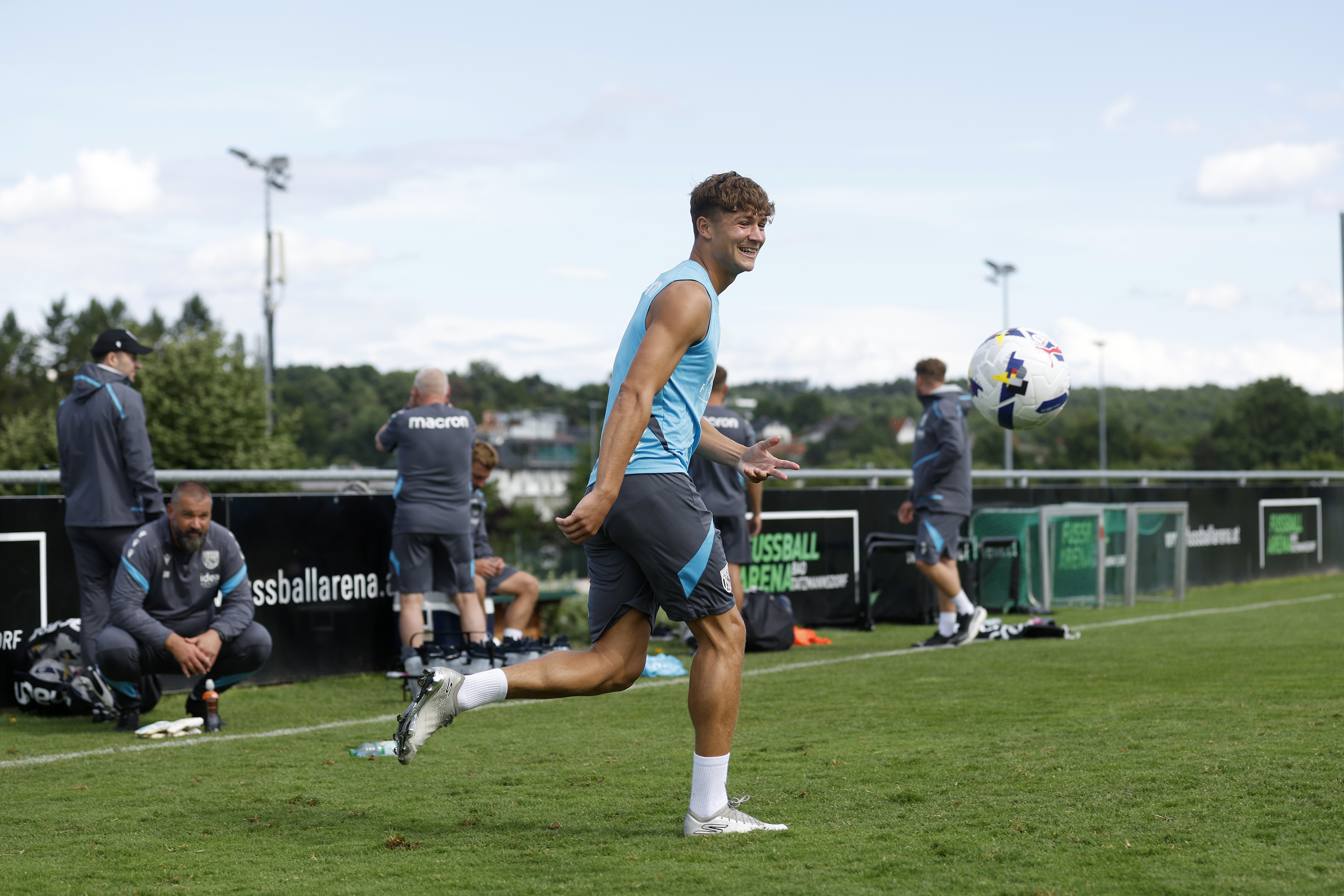 Cole Deeming smiling while on the ball during training 