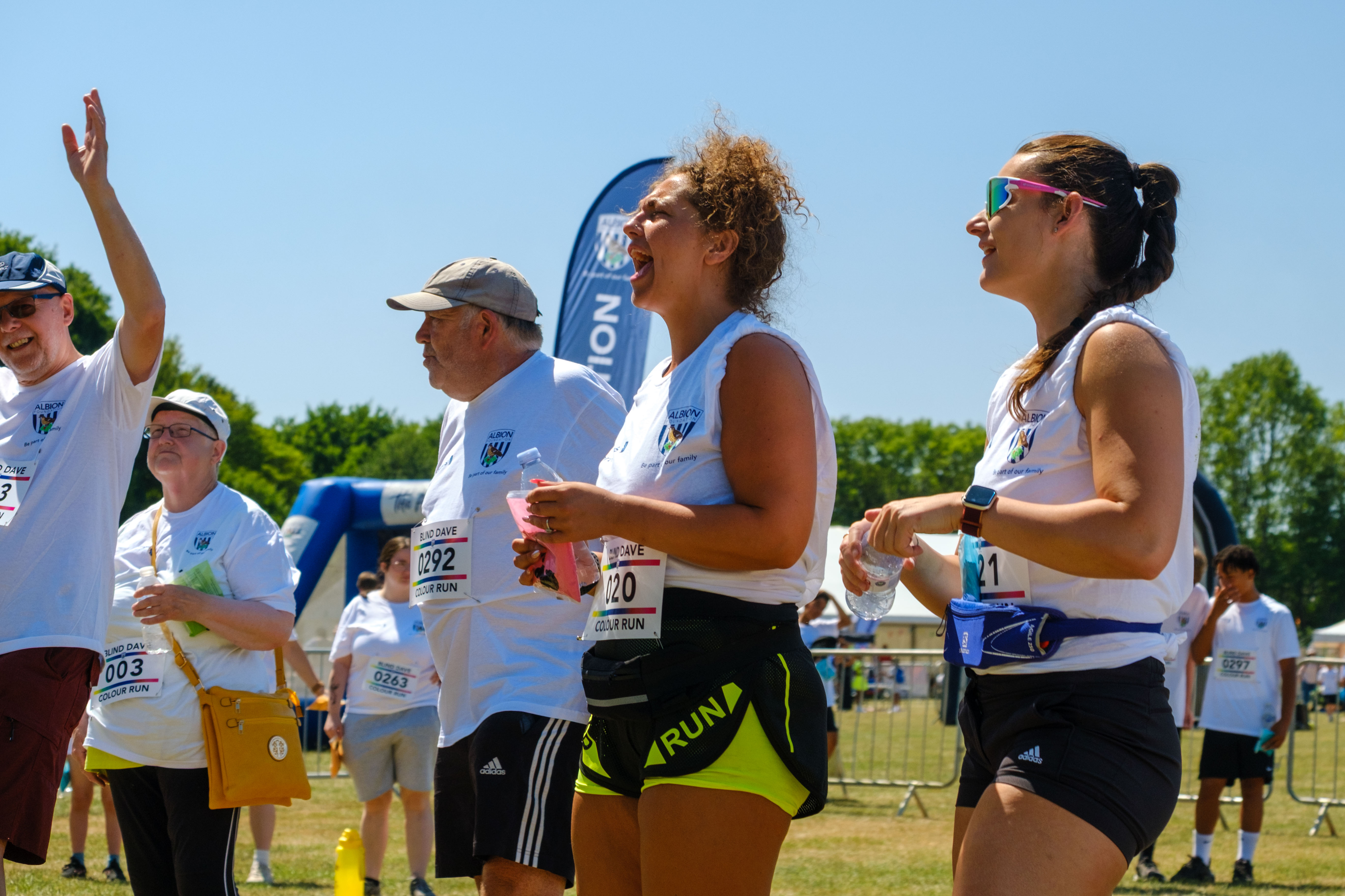 Group of participants shouting with joy in the warm up area