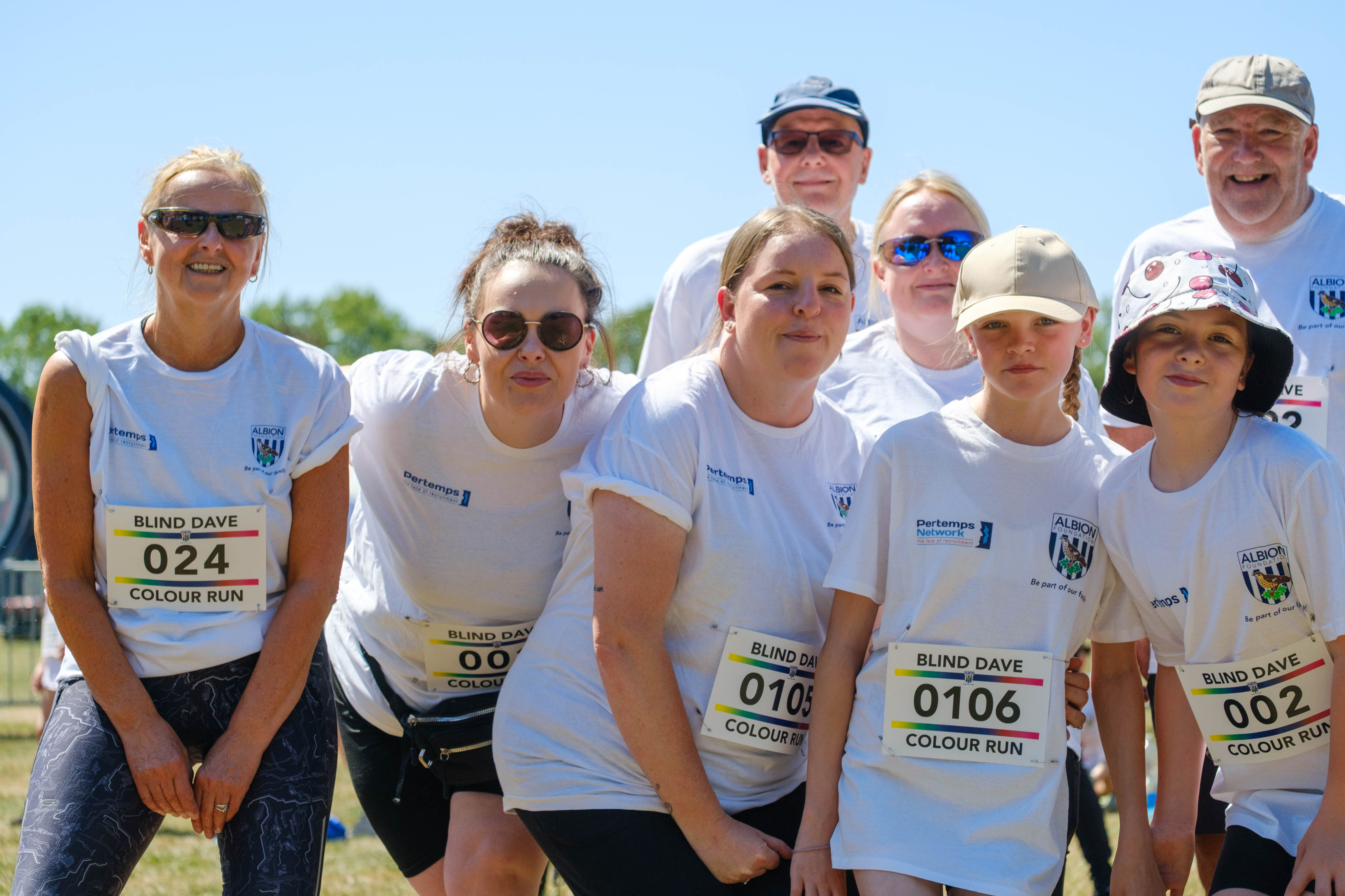 Family of participants smiling for the photo.