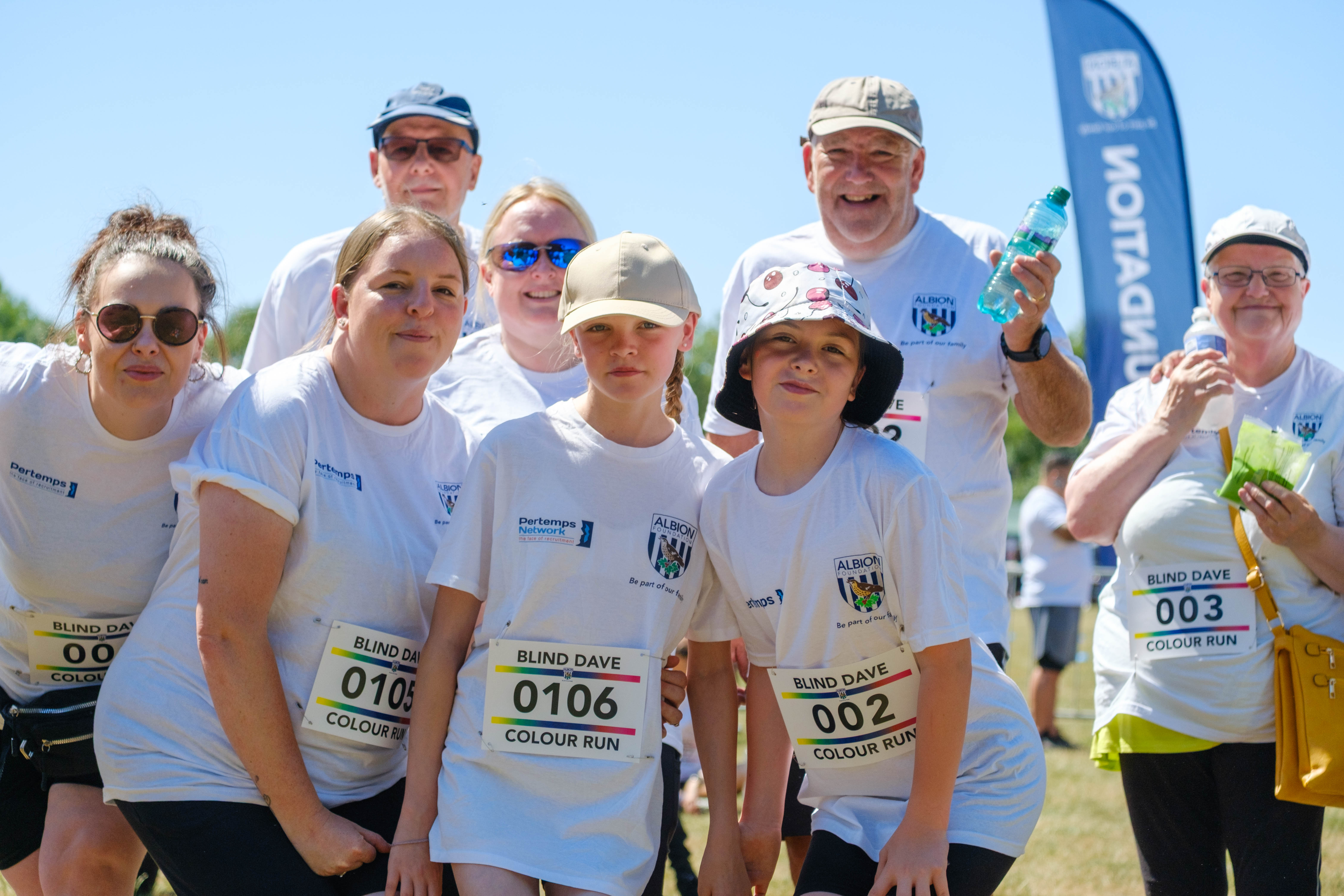 Family of participants smiling for the photo.