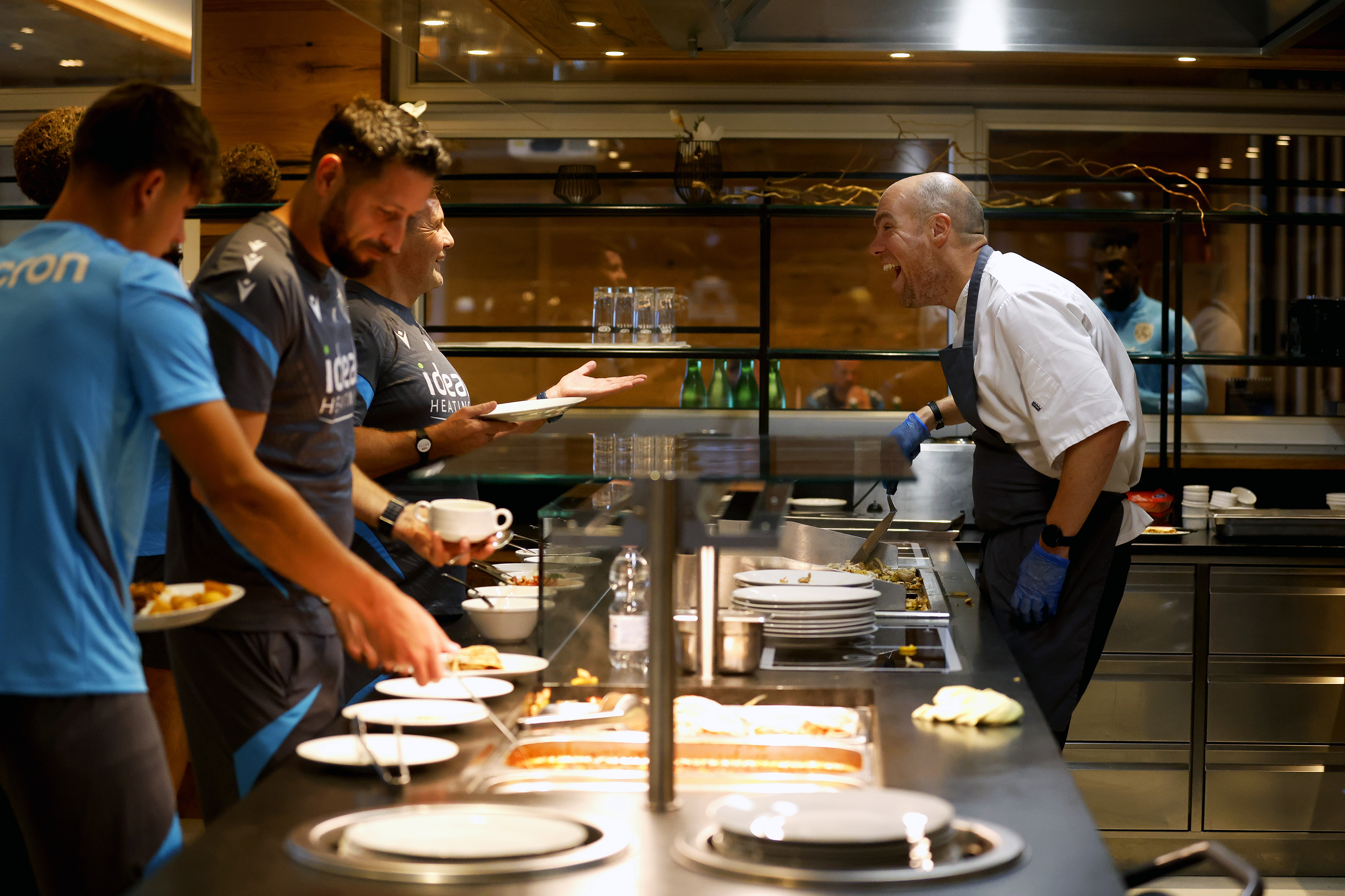 Albion's chef preparing food and talking to players and staff in Austria 
