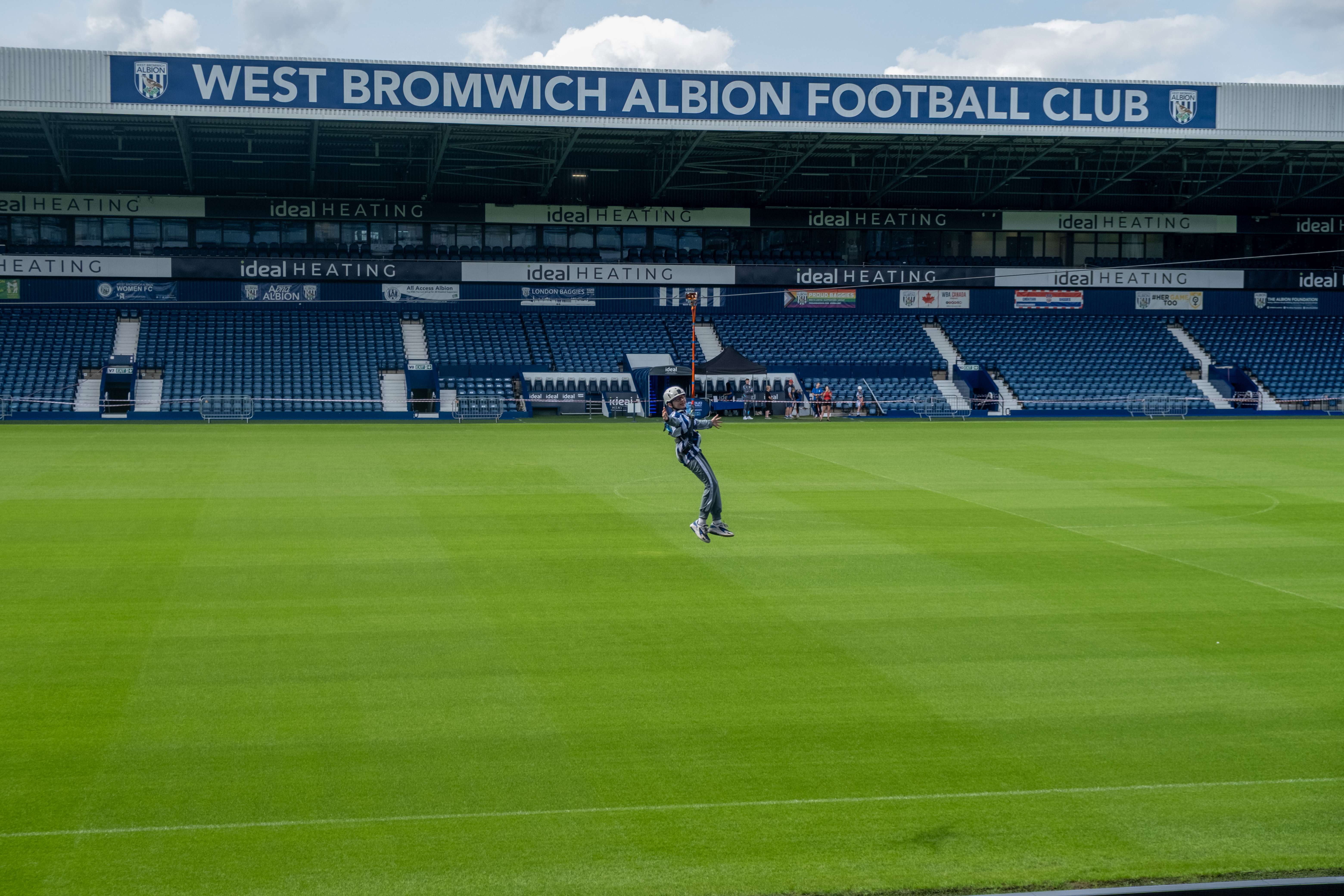 A participant zip wires across The Hawthorns.