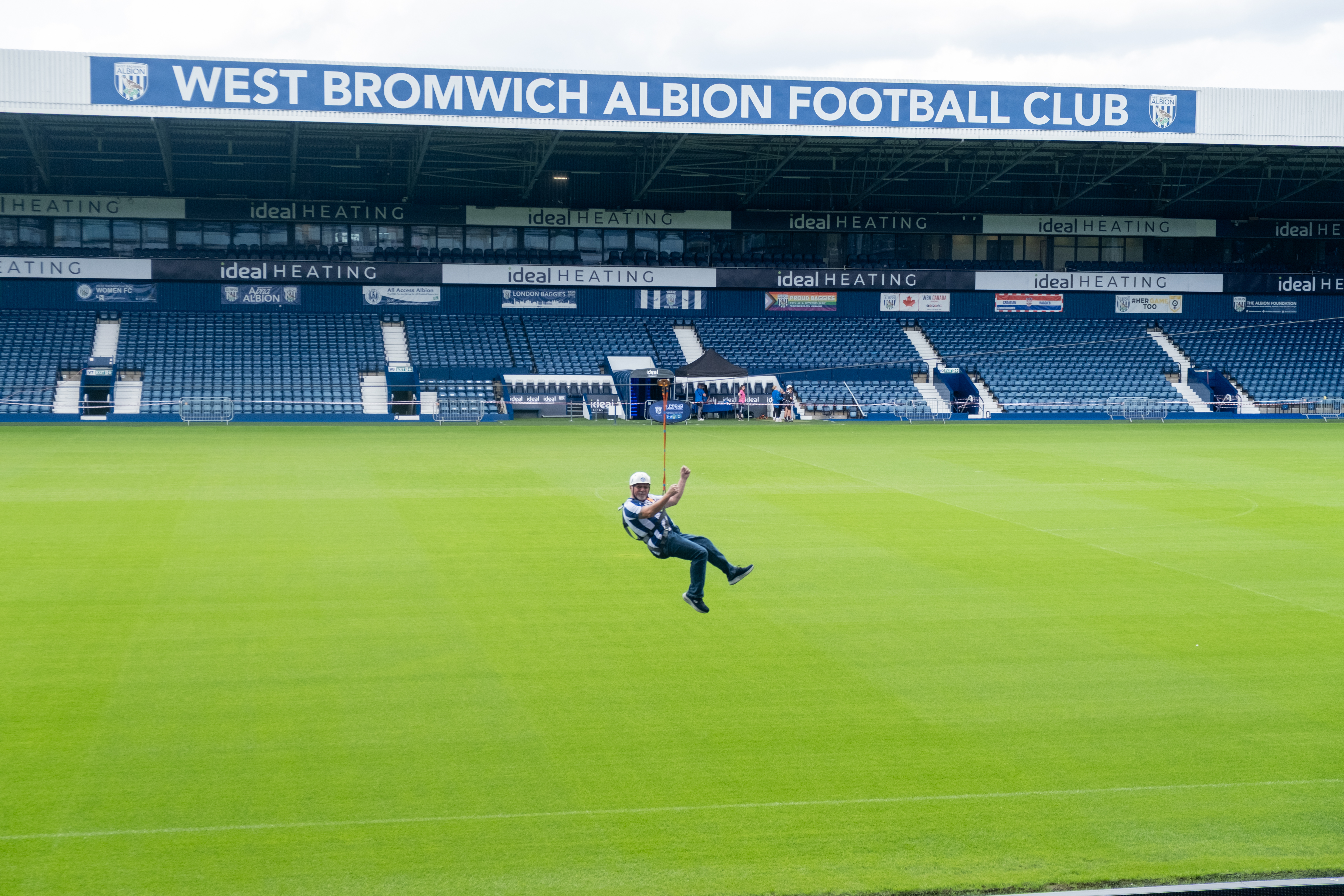 A participant zip wires across The Hawthorns.
