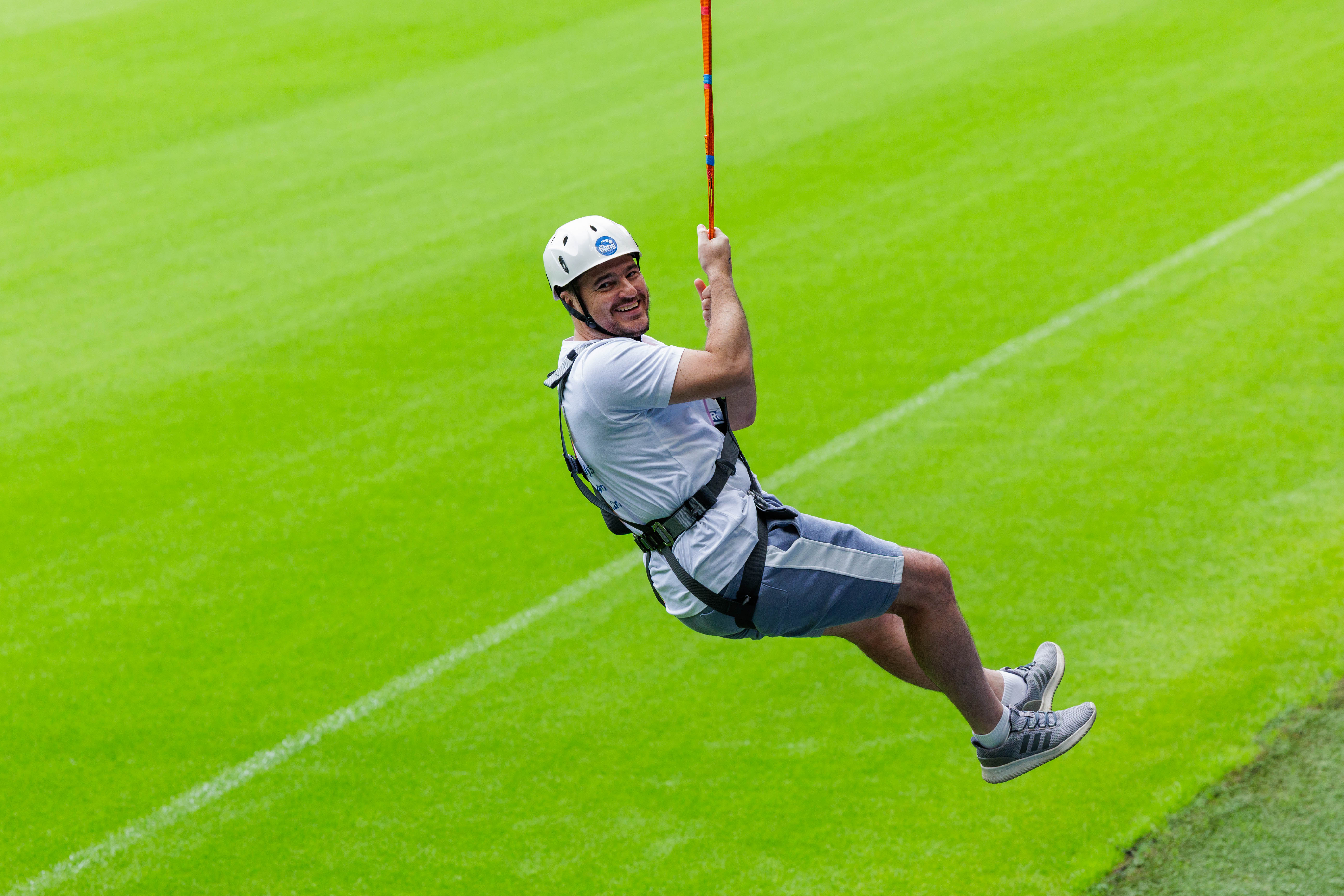 A participant zip wires across The Hawthorns.