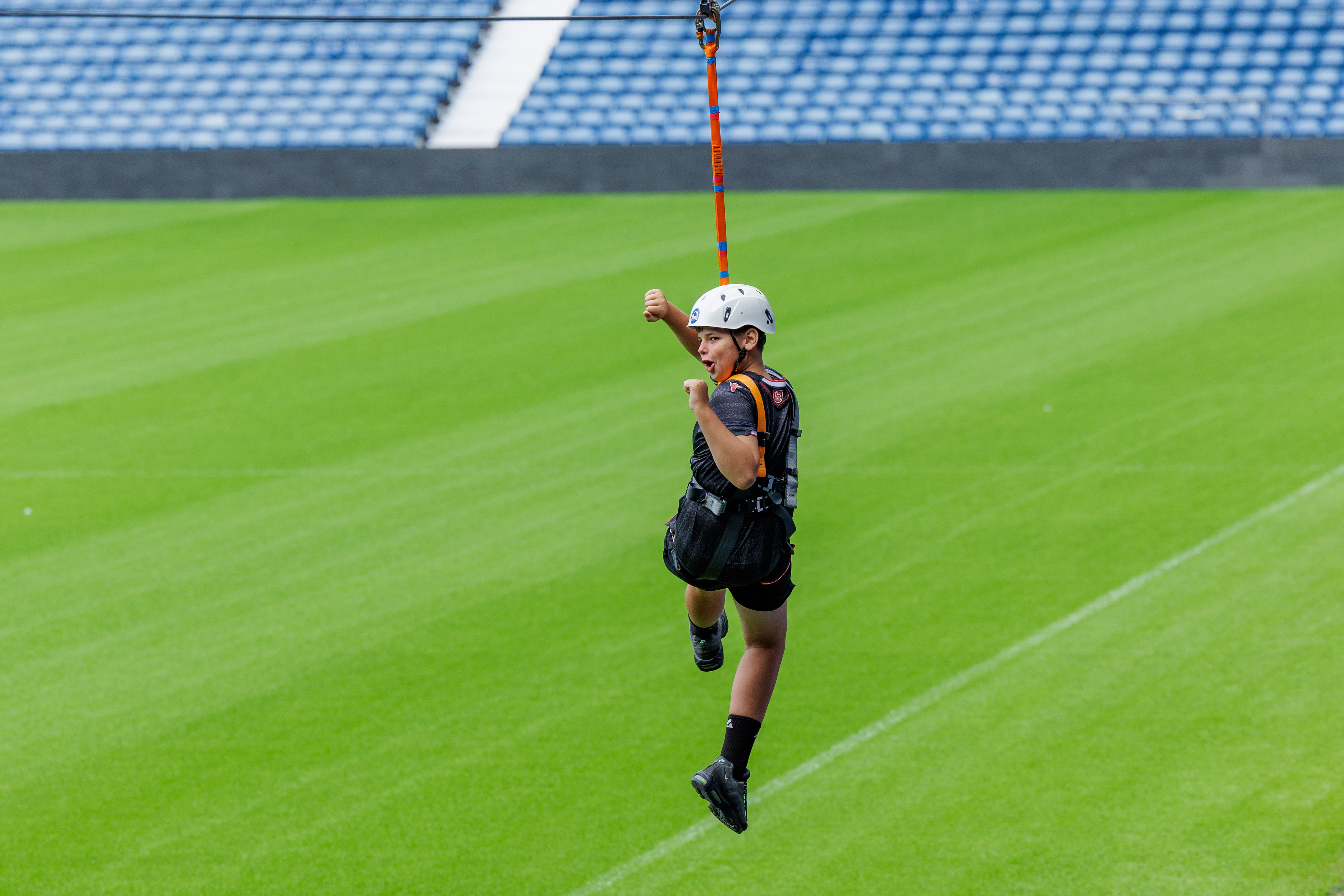 A participant zip wires across The Hawthorns.