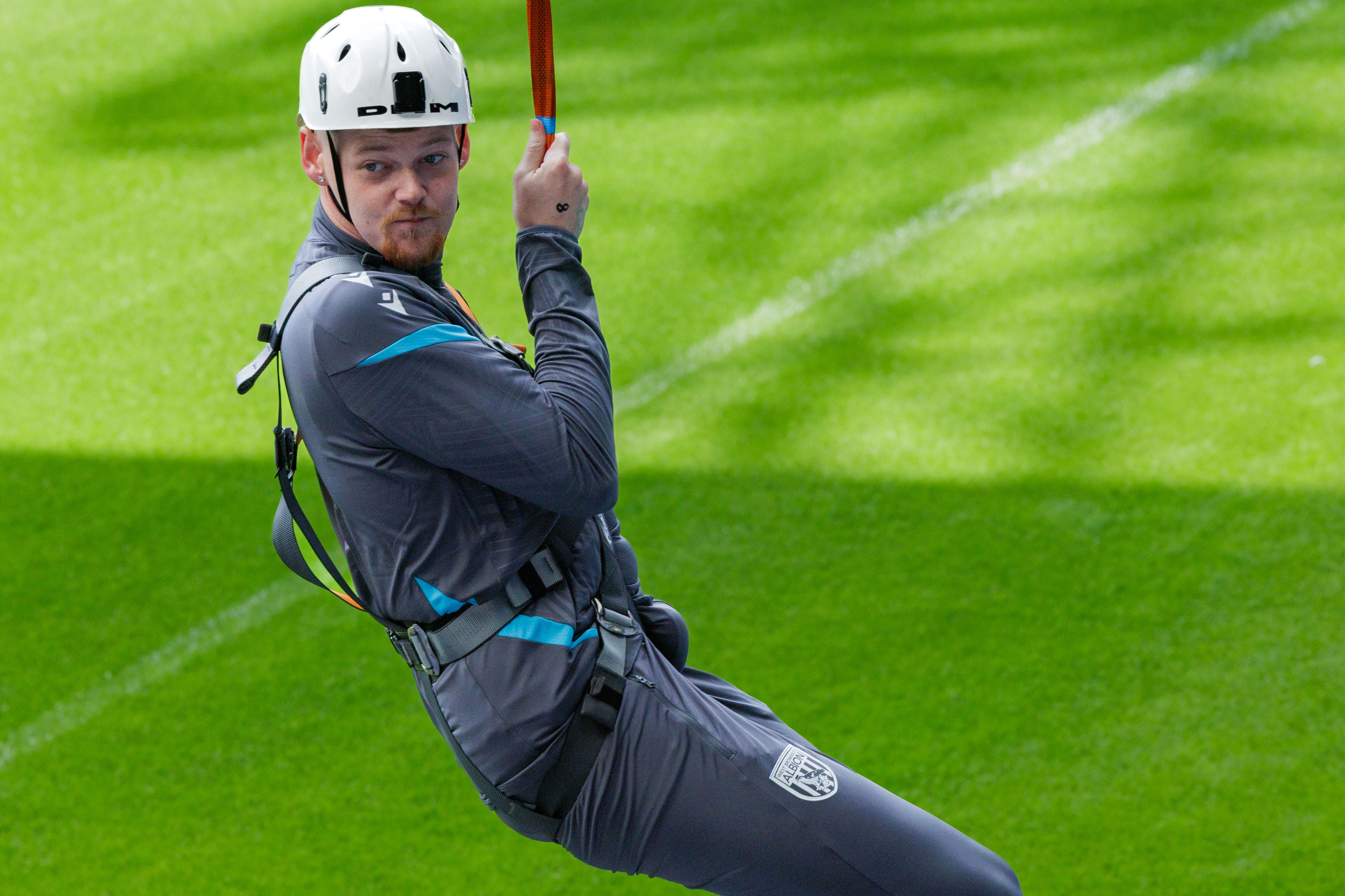 A participant zip wires across The Hawthorns.