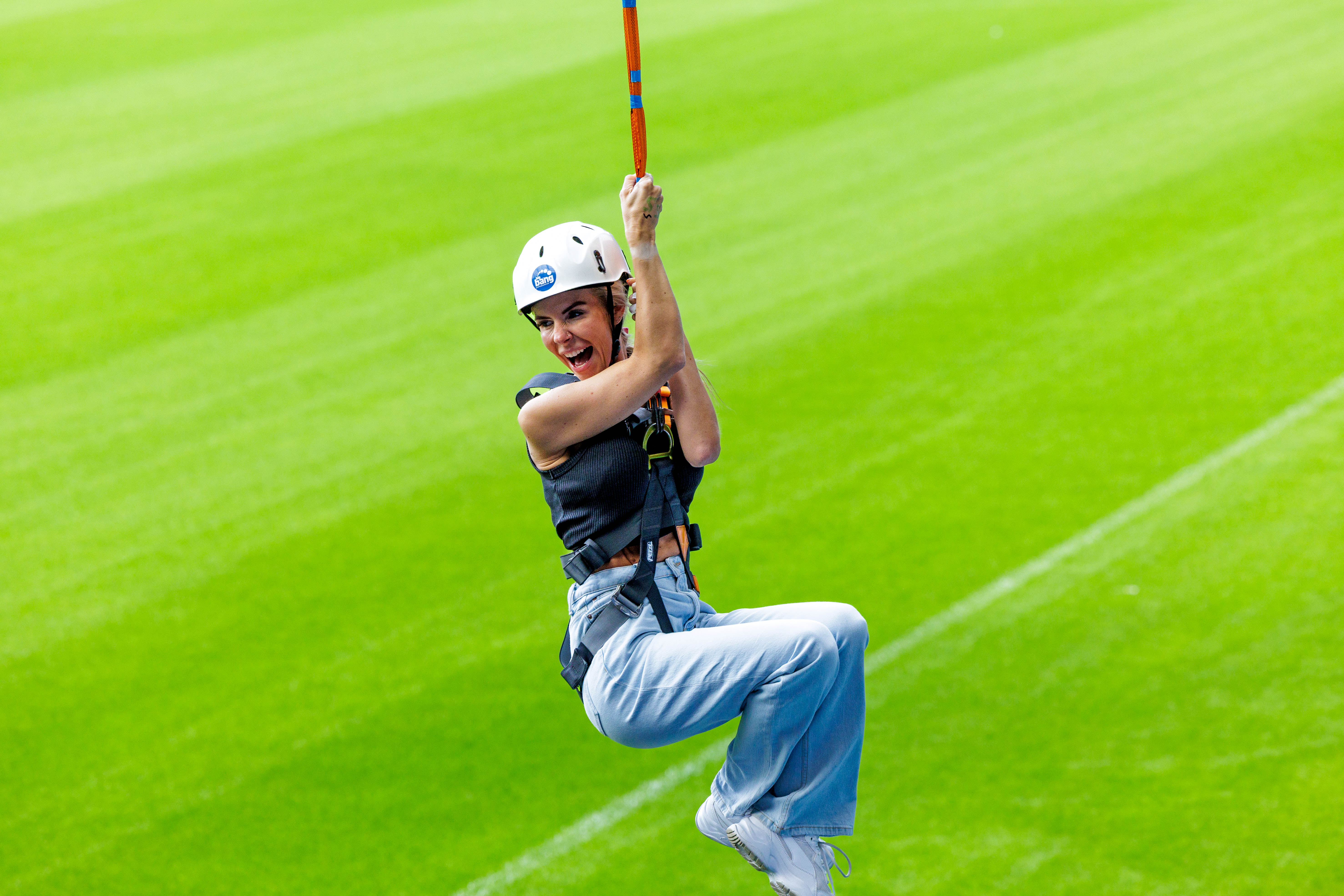 A participant zip wires across The Hawthorns.