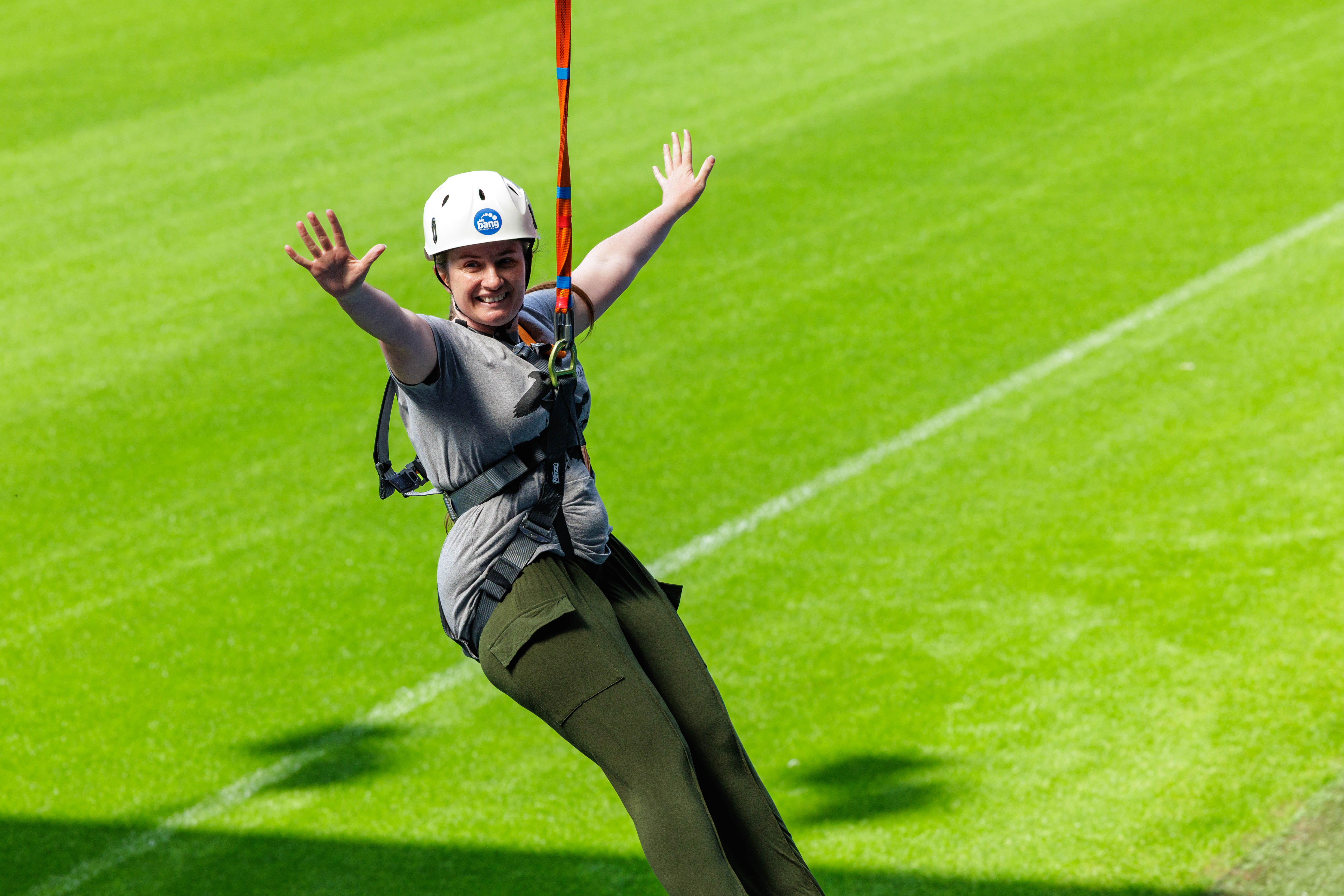 A participant zip wires across The Hawthorns.