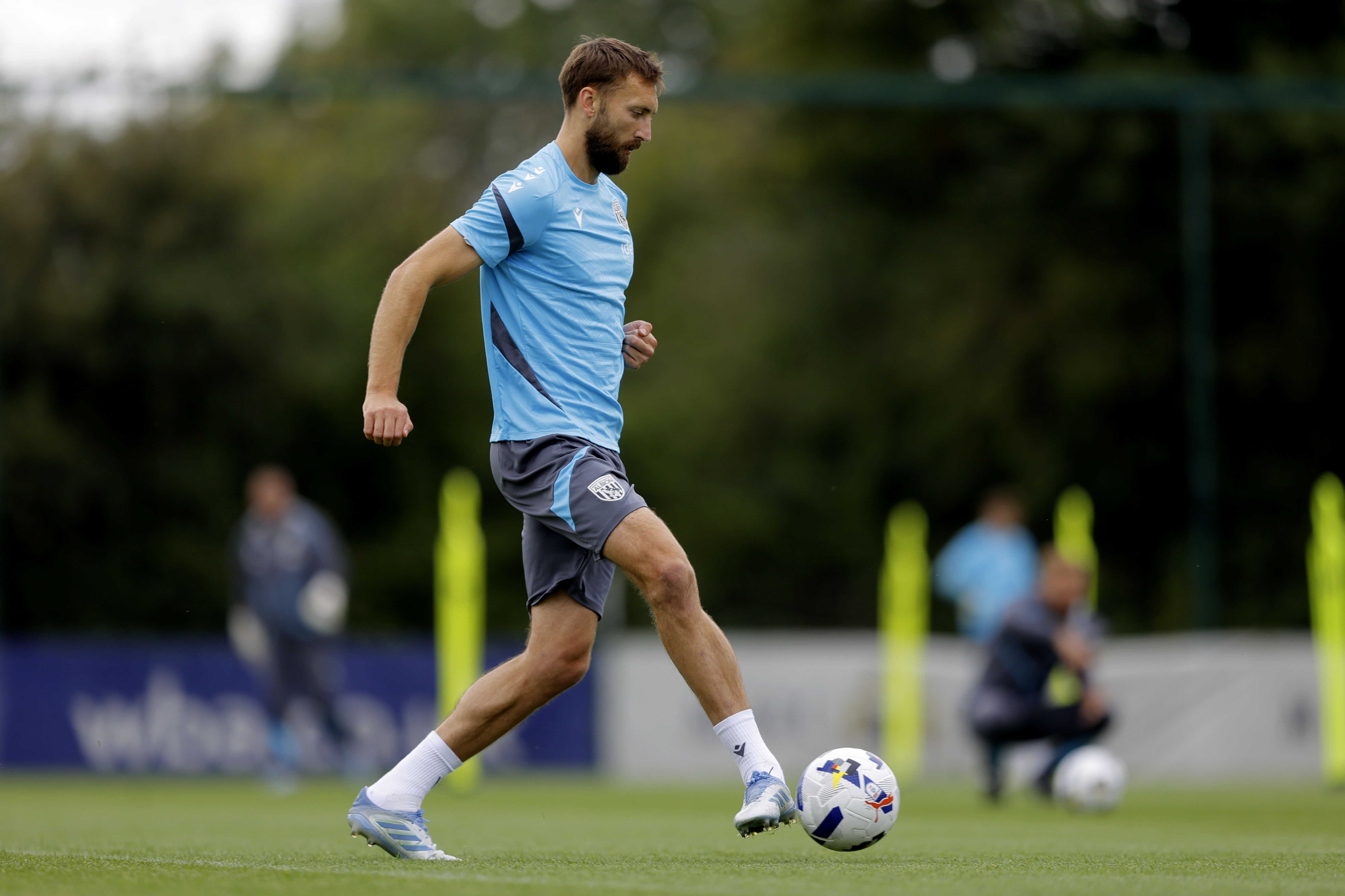 Nat Phillips passing the ball during training 
