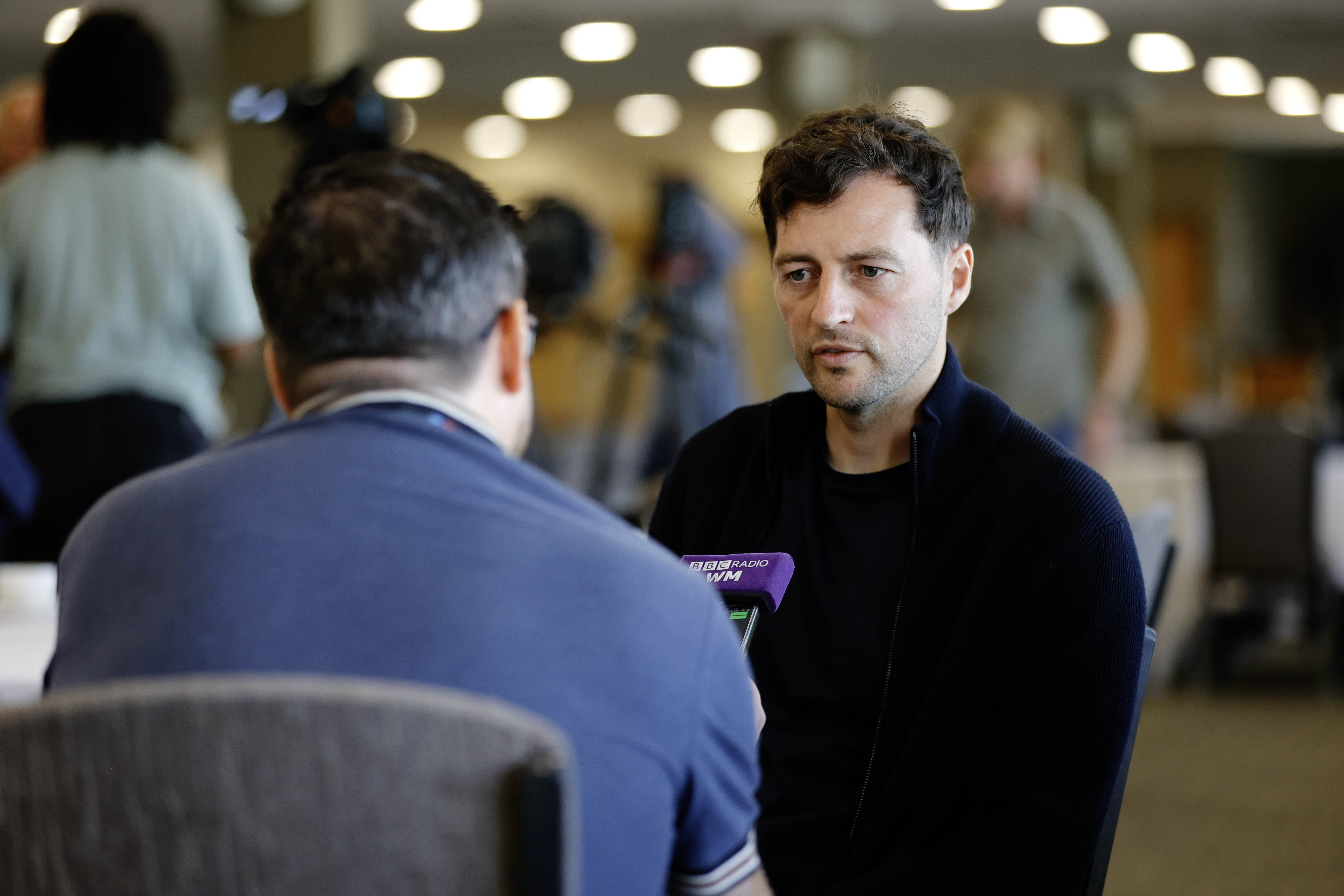 Ryan Mason talking to a radio reporter 