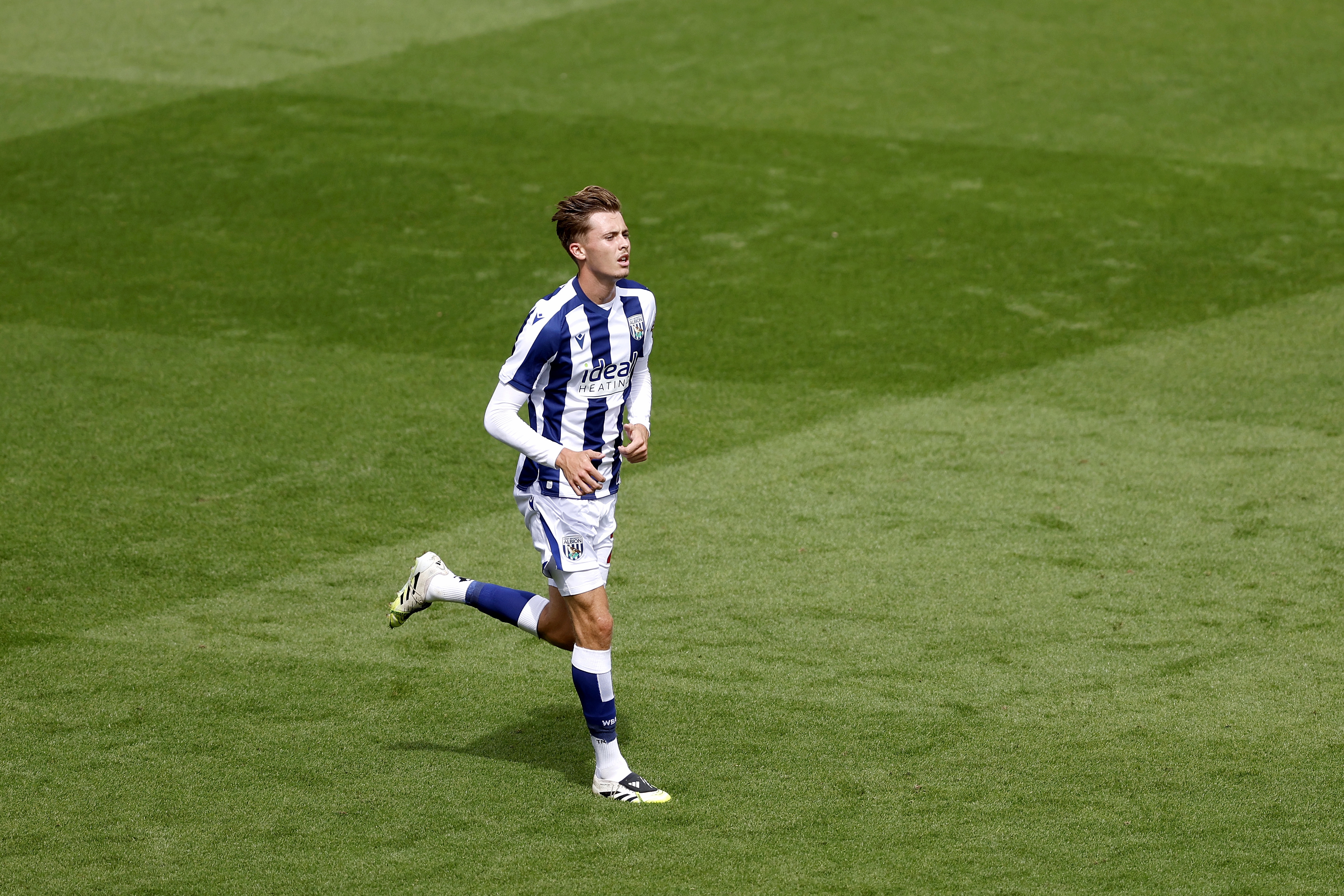 Isaac Price in pre-season action for Albion at Blackpool in the home kit 